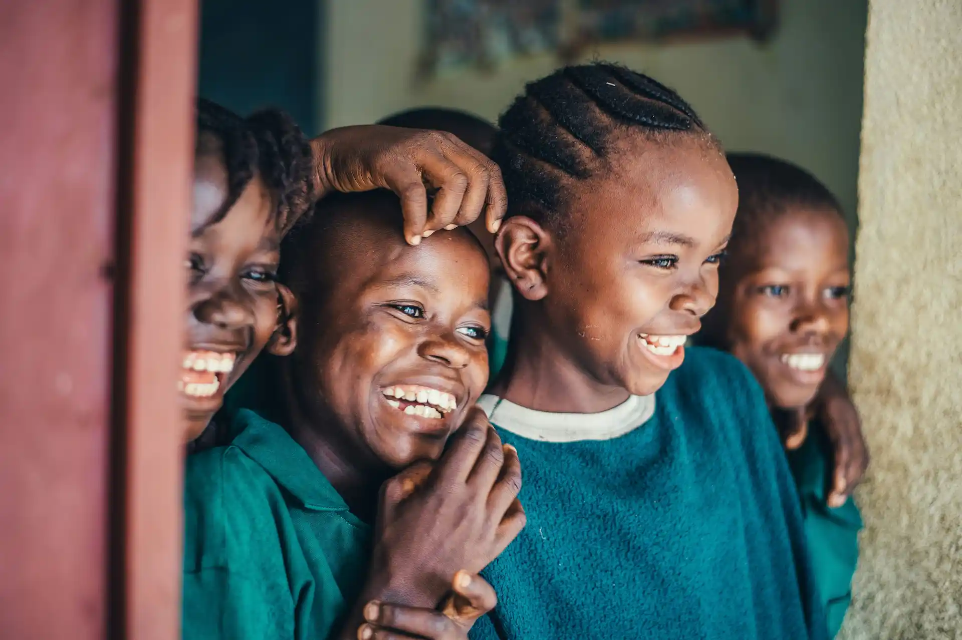 group of childrens sitting on ground