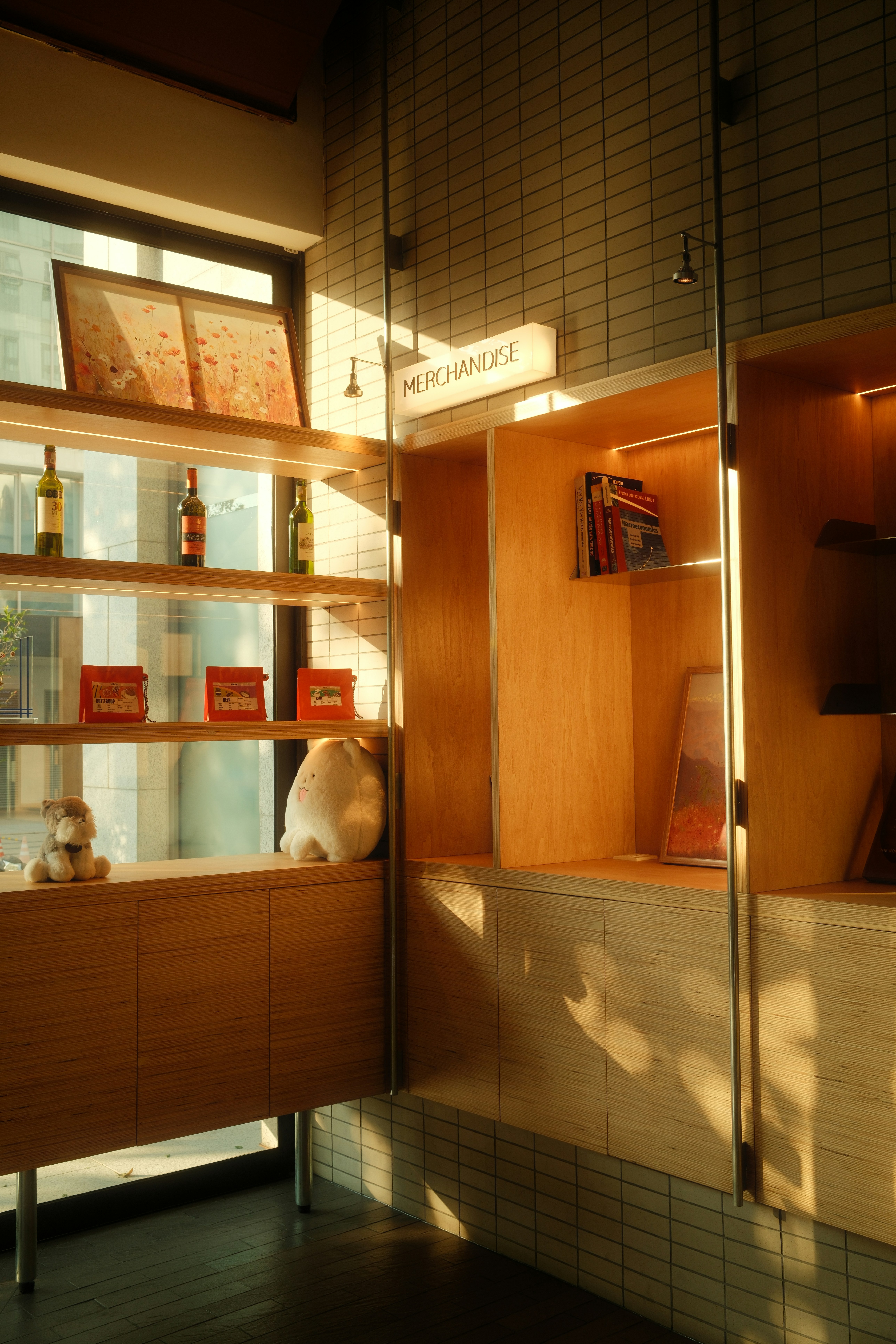 Sunlight streams across a store display with merchandise.