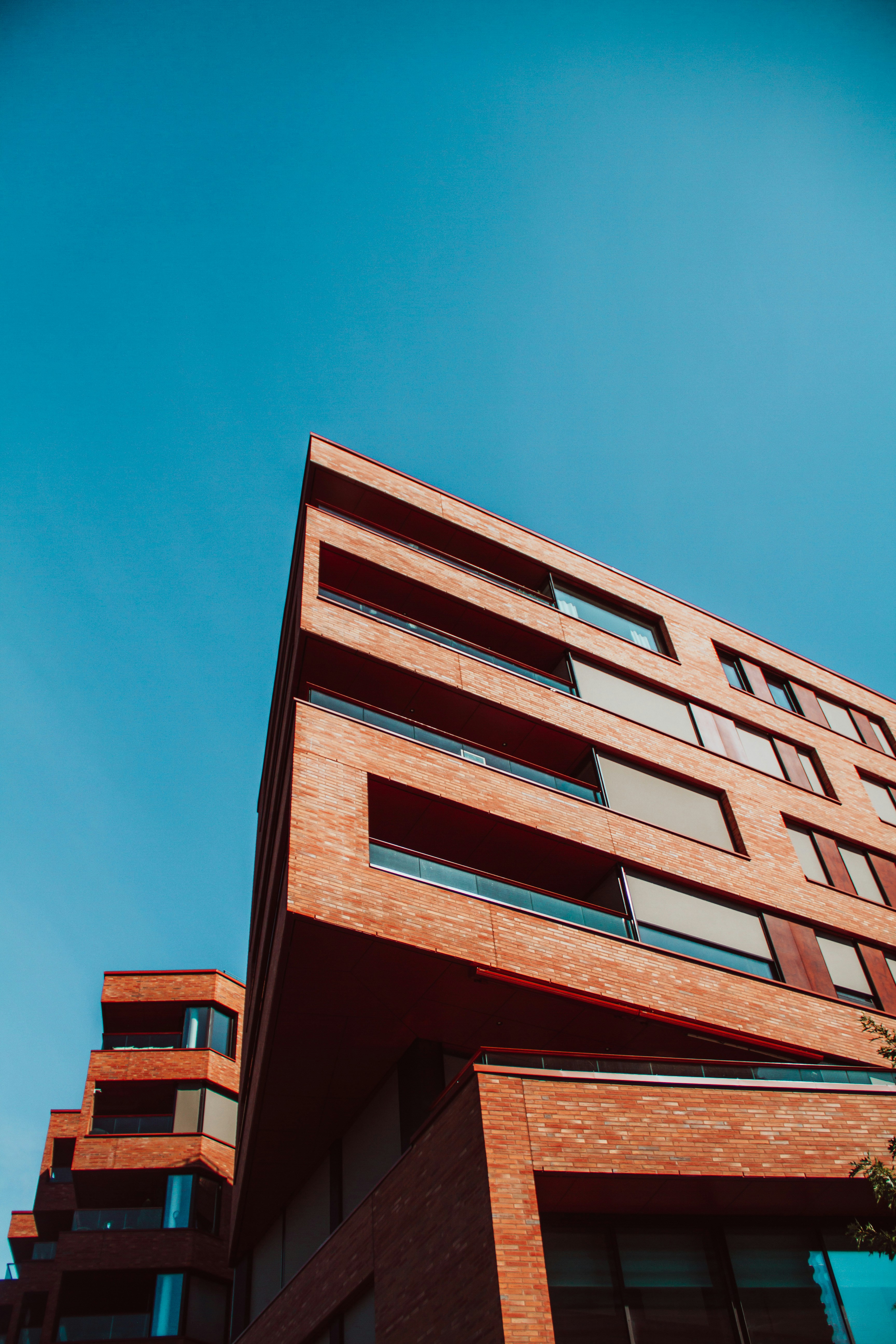 brown concrete building under blue sky during daytime