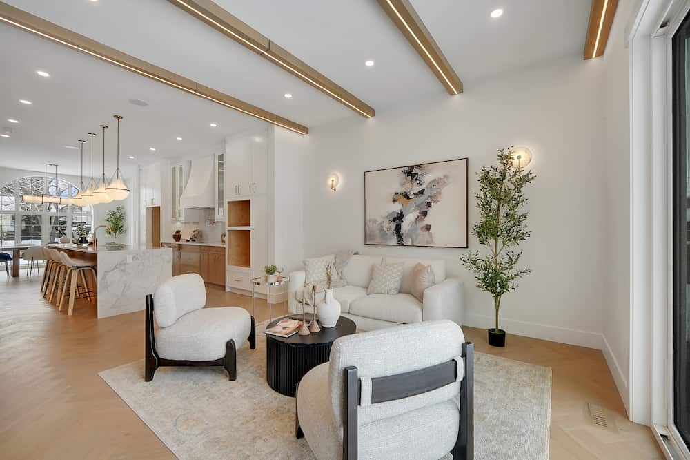 Open-concept living and dining area with floor-to-ceiling windows