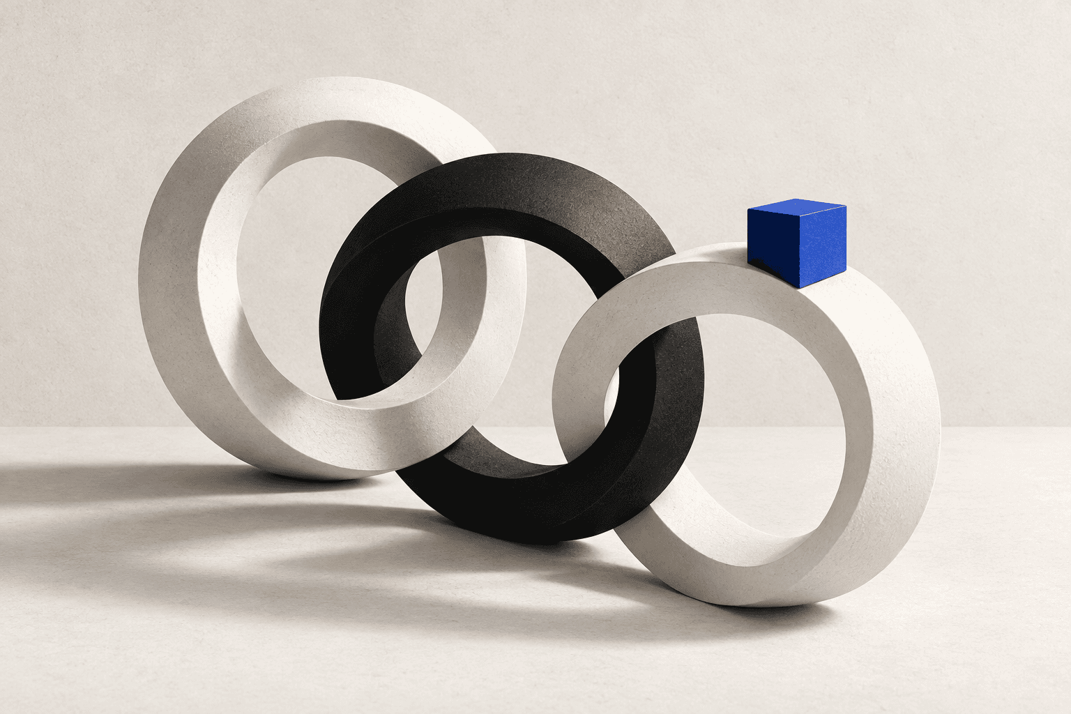 Interlocking monochrome rings with a blue checkpoint cube.