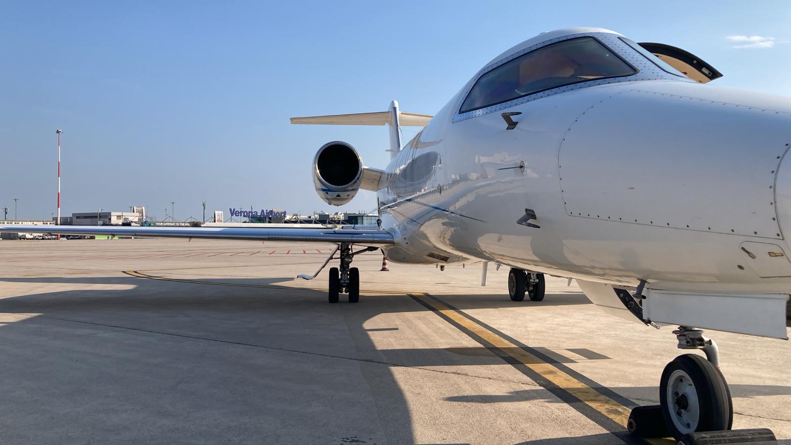 Helicopter and private jet on the runway