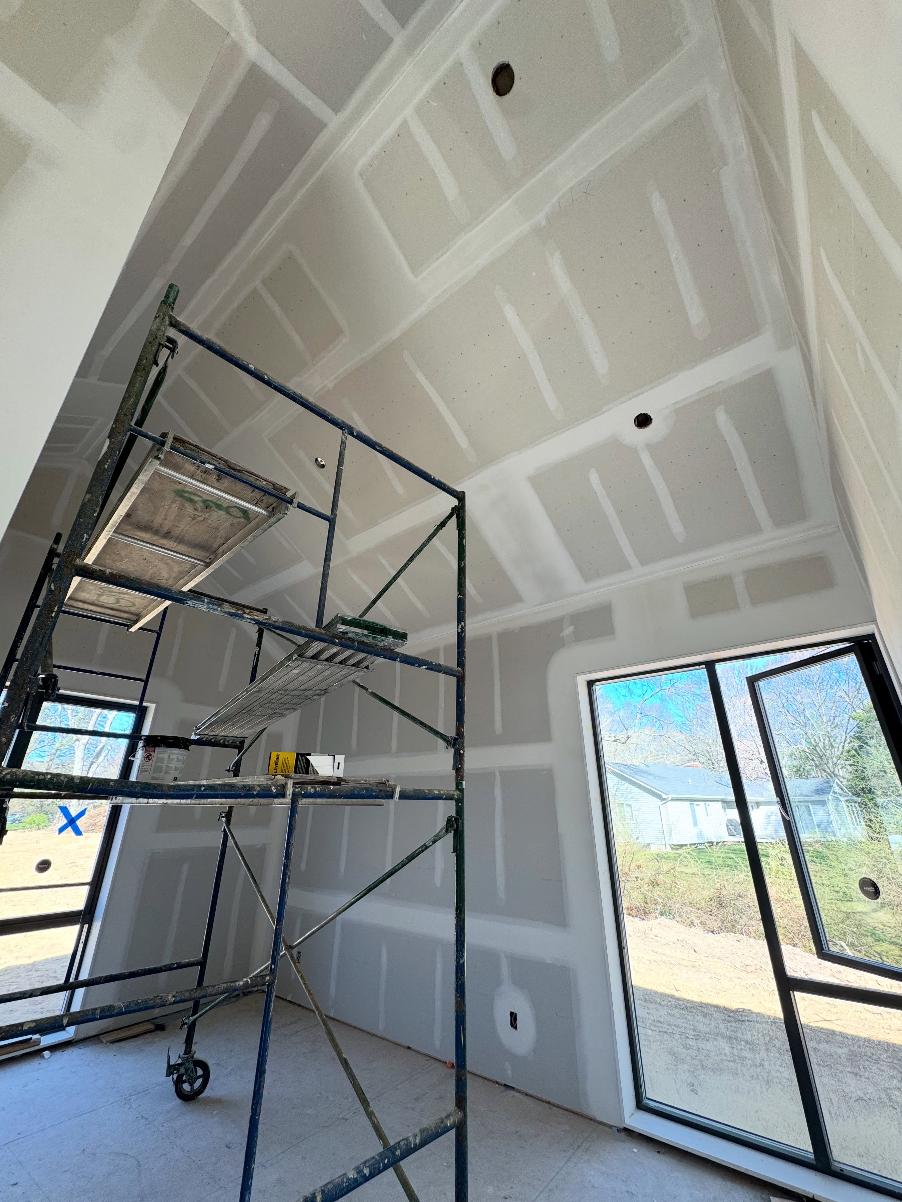 Attic framing with scaffold during insulation work