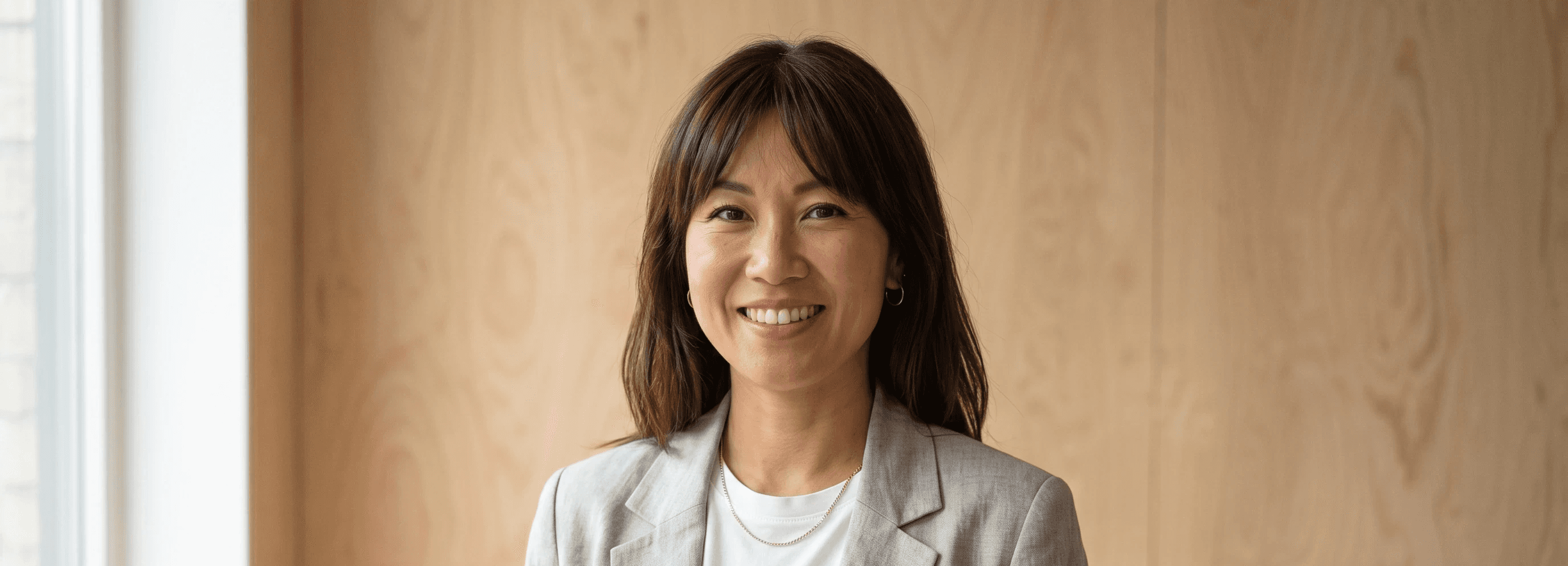 Portrait of Elena Voss, Co-Founder and CEO, with long brown hair in a dark blazer