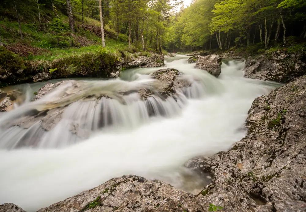 Silky water flowing through Mostnica Gorge during spring in Slovenia.