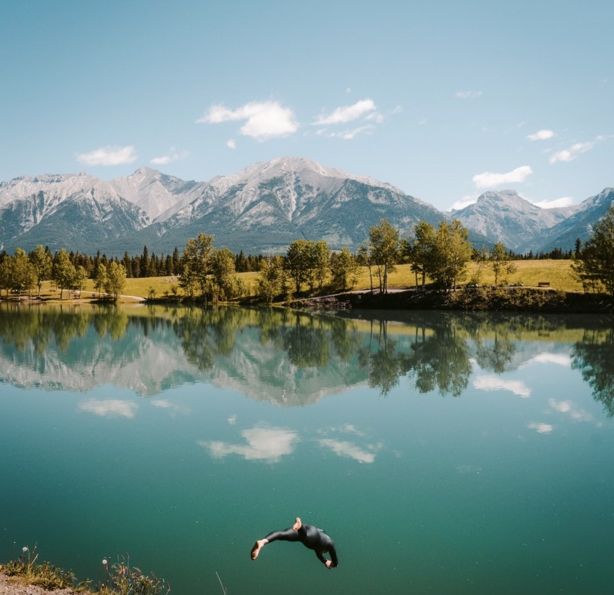 image of a man diving in a lake