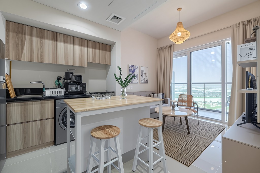 A sleek modern apartment with an inviting living room and dining area, perfect for entertaining guests and family.