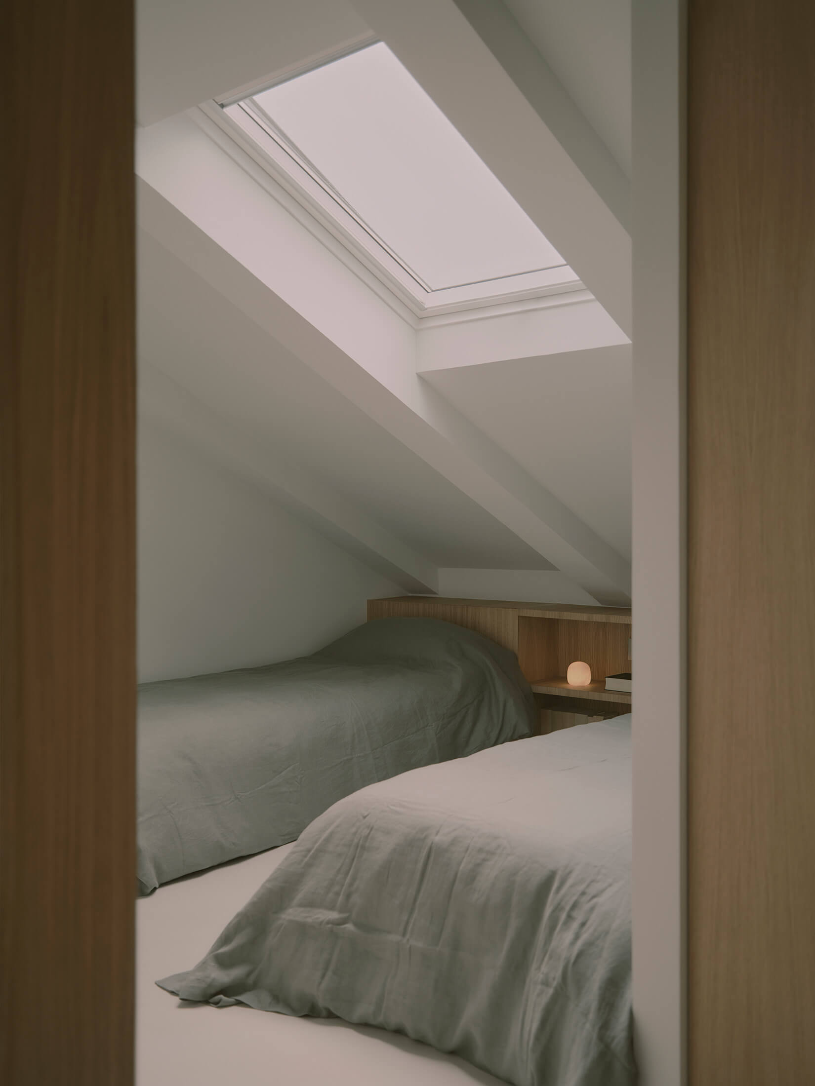 Attic bedroom with skylight window