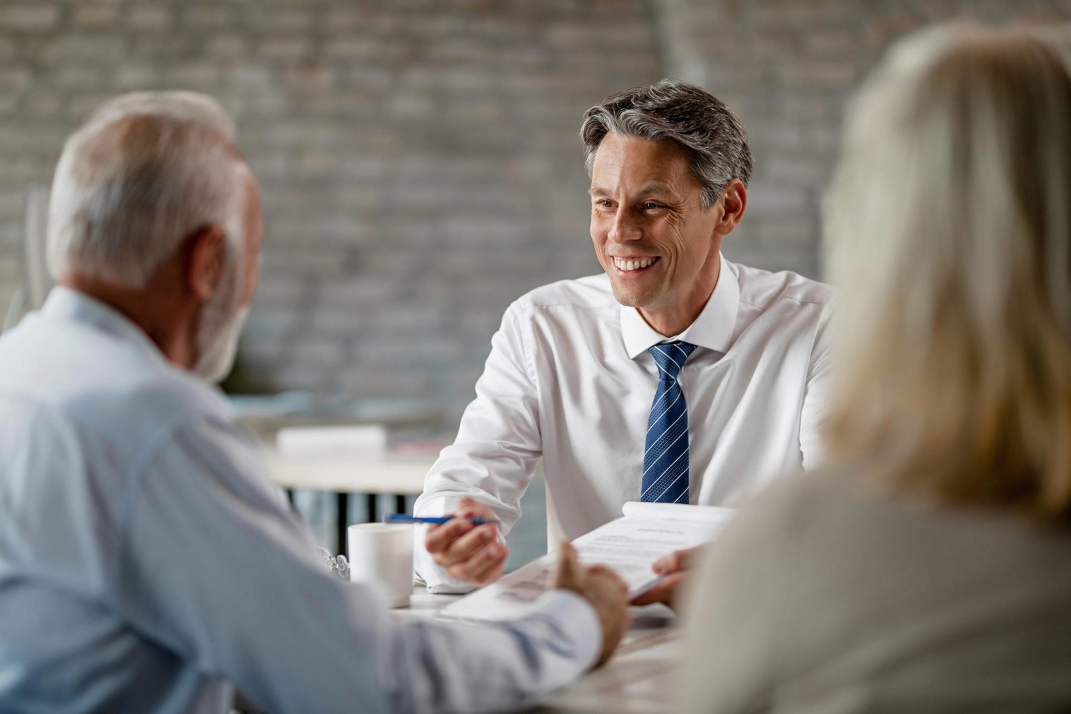 brisbane finance broker smiling and conducting loan settlement