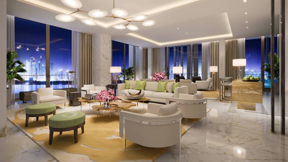 A beautifully decorated living room in The Royal Atlantis, highlighted by tasteful gold accents in the furnishings.