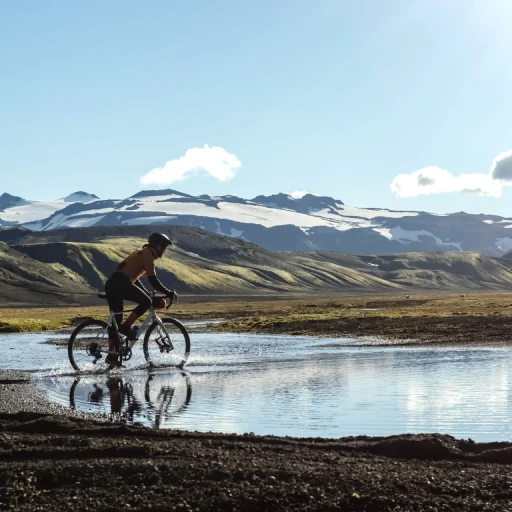 Person cycling bike through Iceland