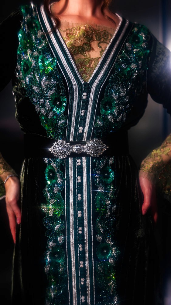 Deep Green Moroccan caftan with emerald embroidery, handcrafted luxury design combining Bahrain atelier and Moroccan craftsmanship