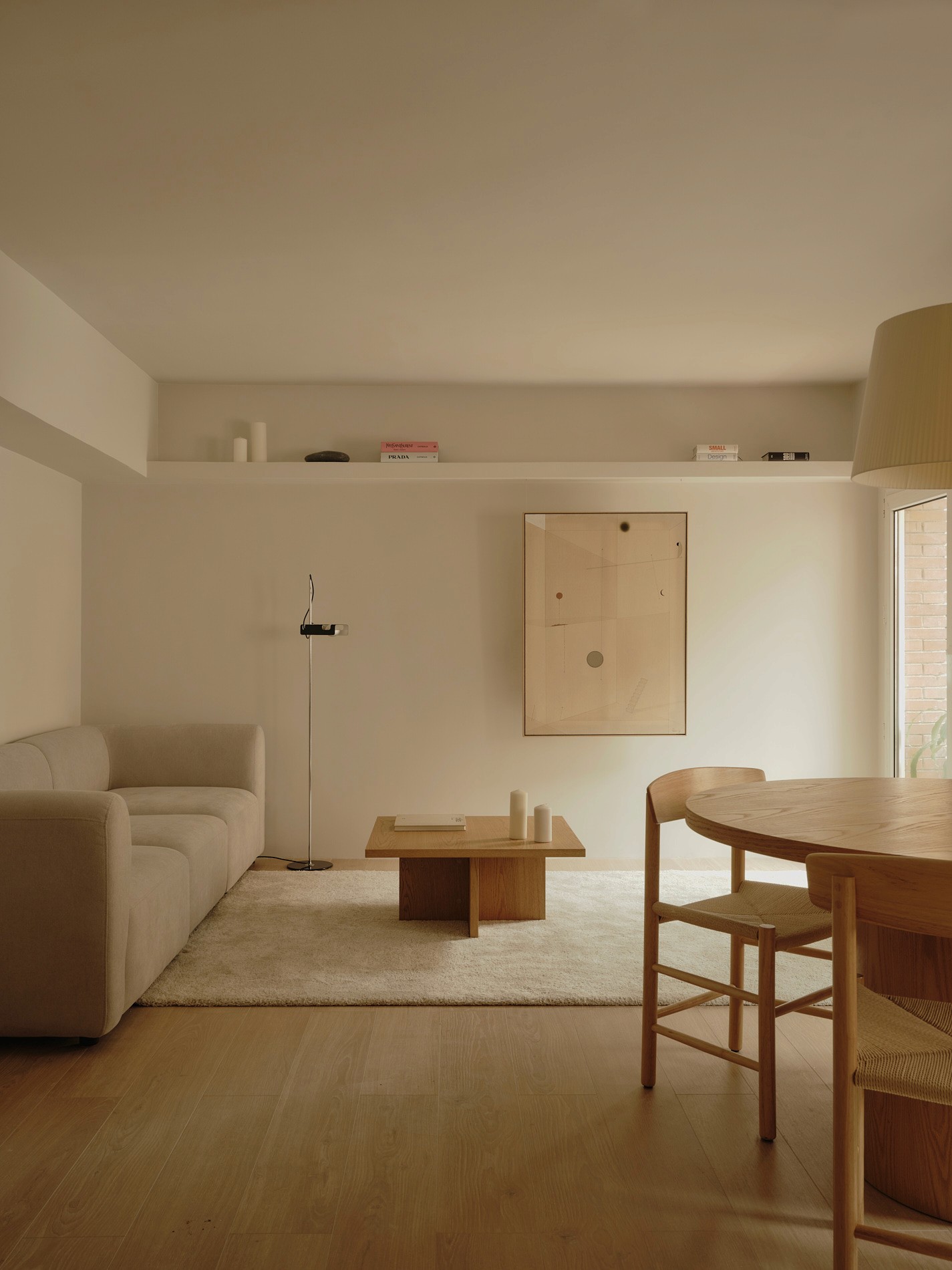 Soft-toned living room with built-in shelving