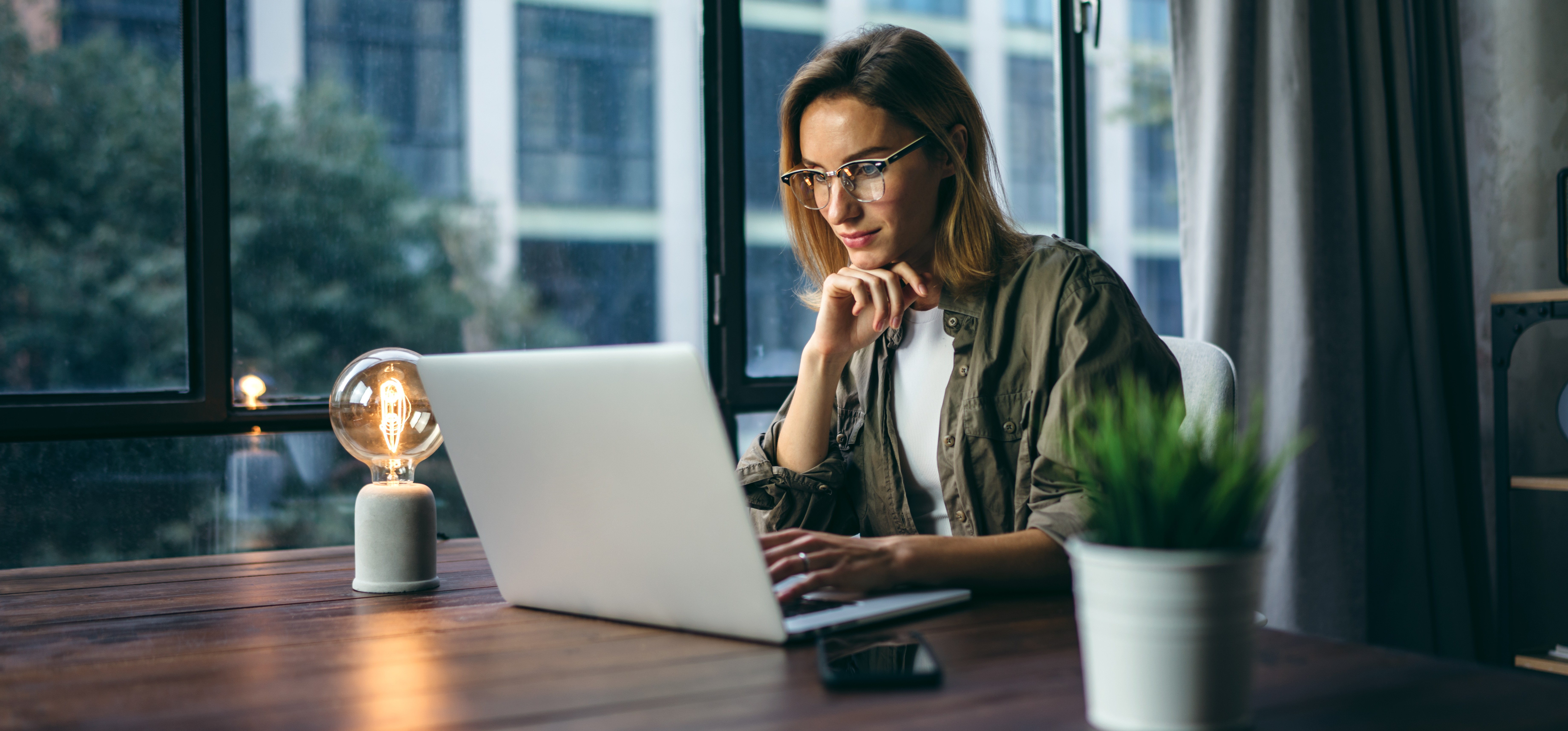 Woman working on laptop in office