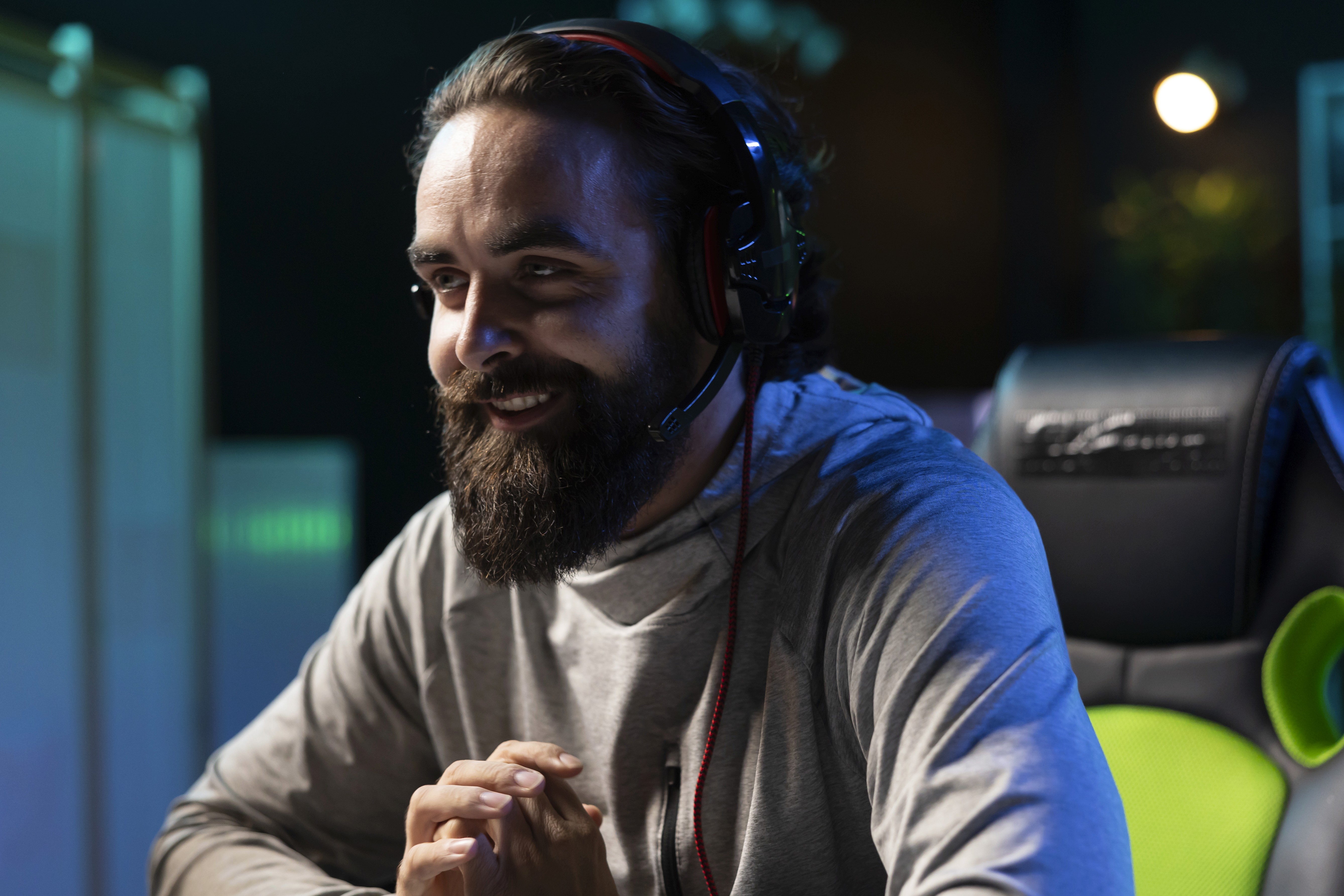 Man having fun gaming and laughing with friends