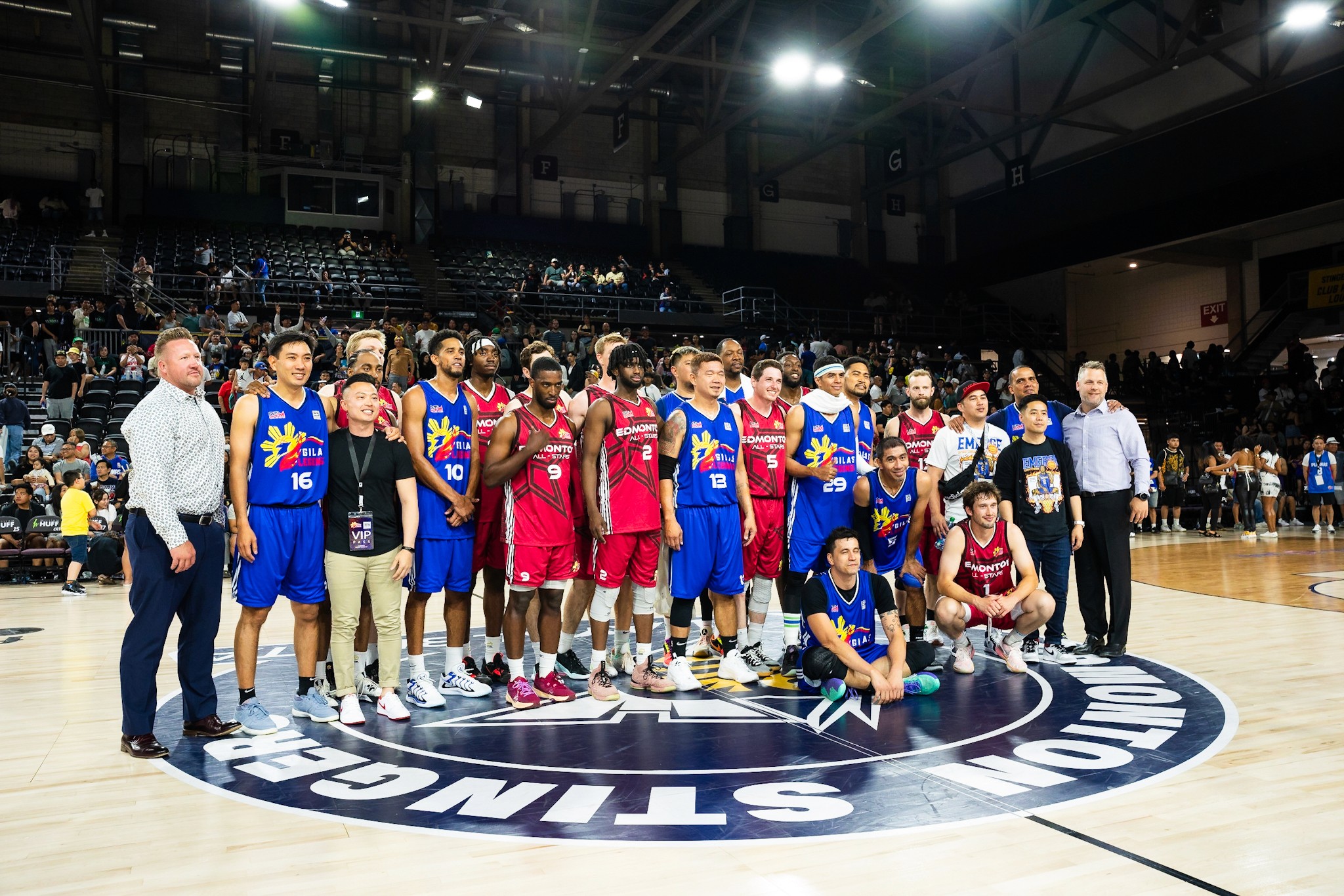 Two basketball teams taking a picture