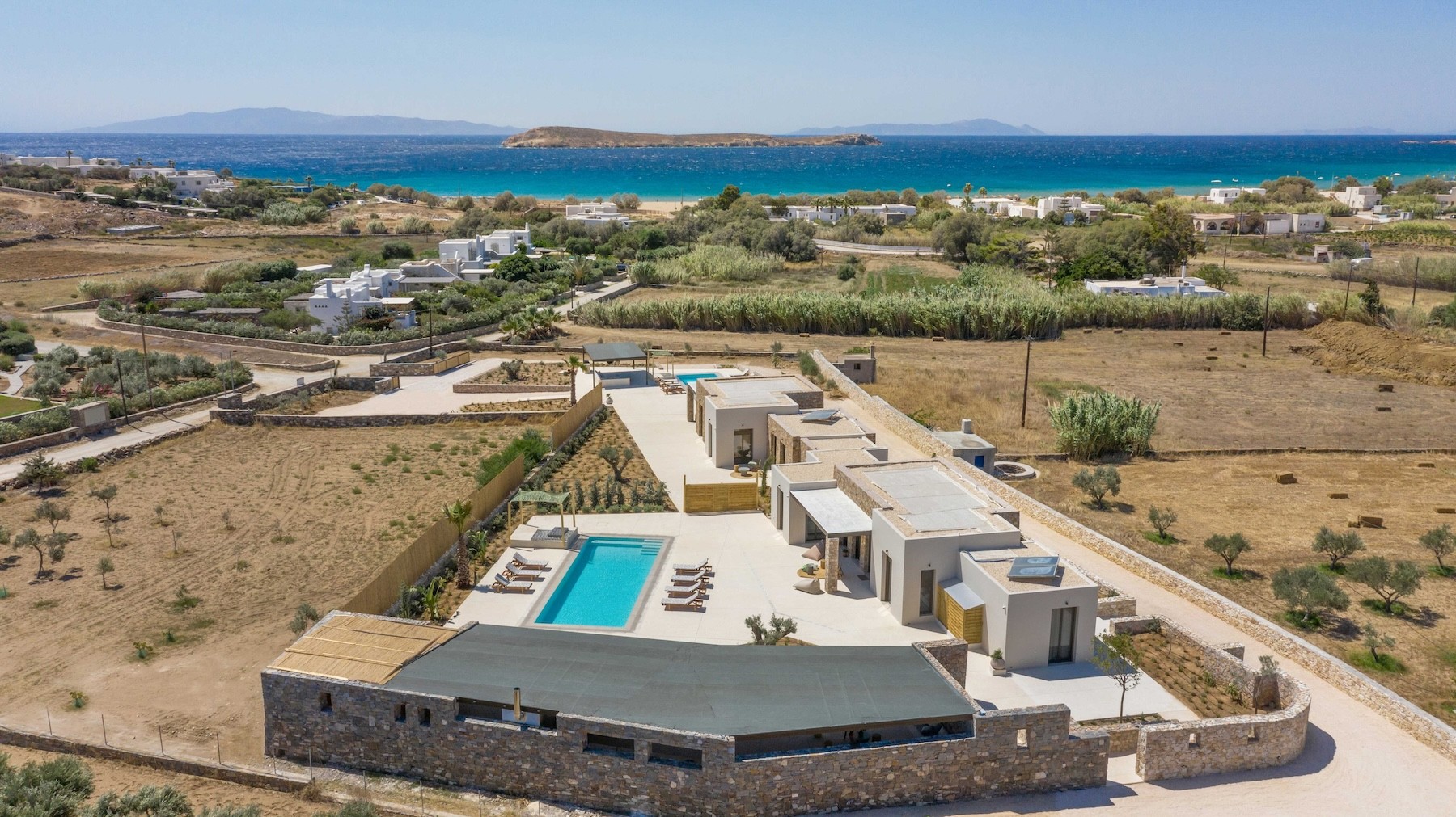 Drone view of modern minimal villa in chrisi akti paros