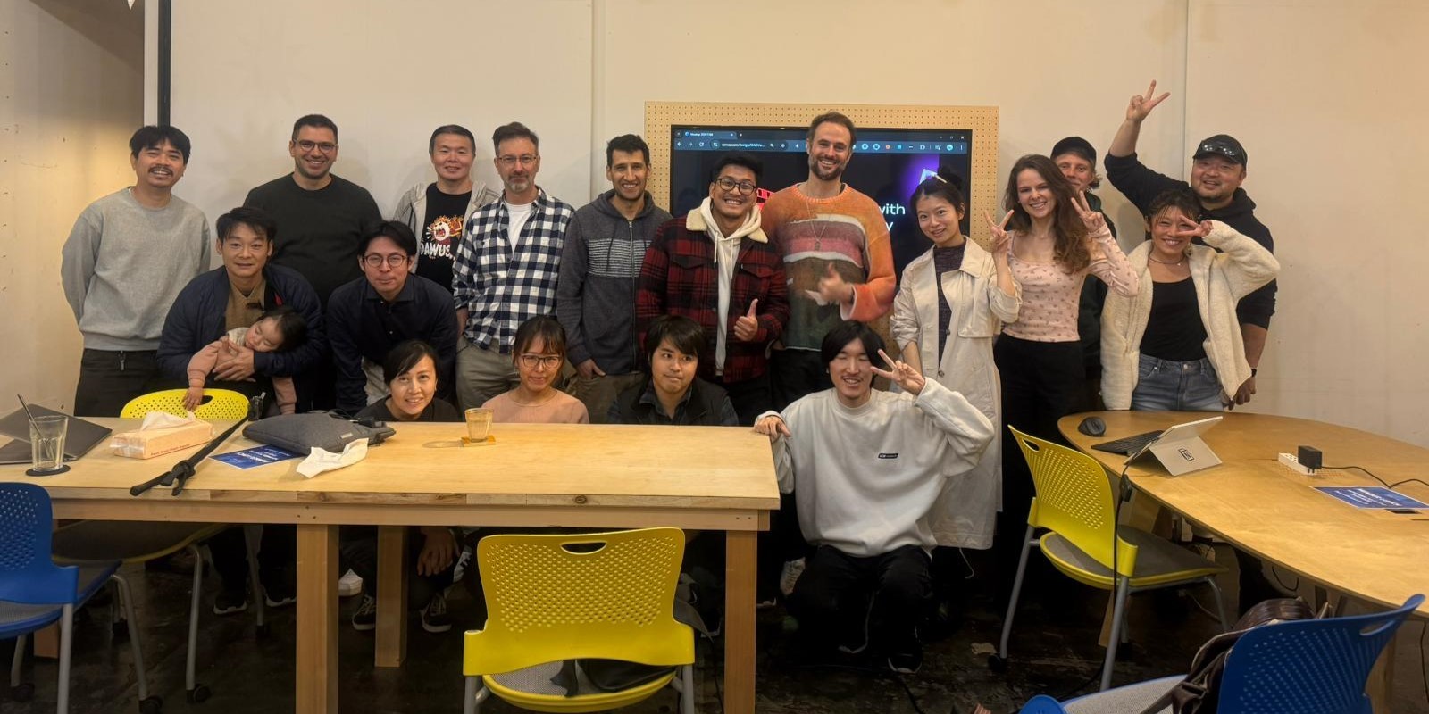 standing and sitting of people taking group photo