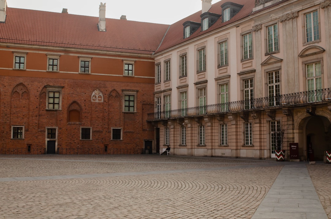 Buildings surround a cobblestone courtyard.