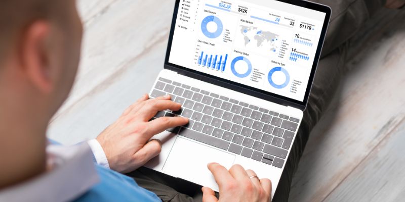 Sales pipeline dashboard with revenue and order charts open on a laptop
