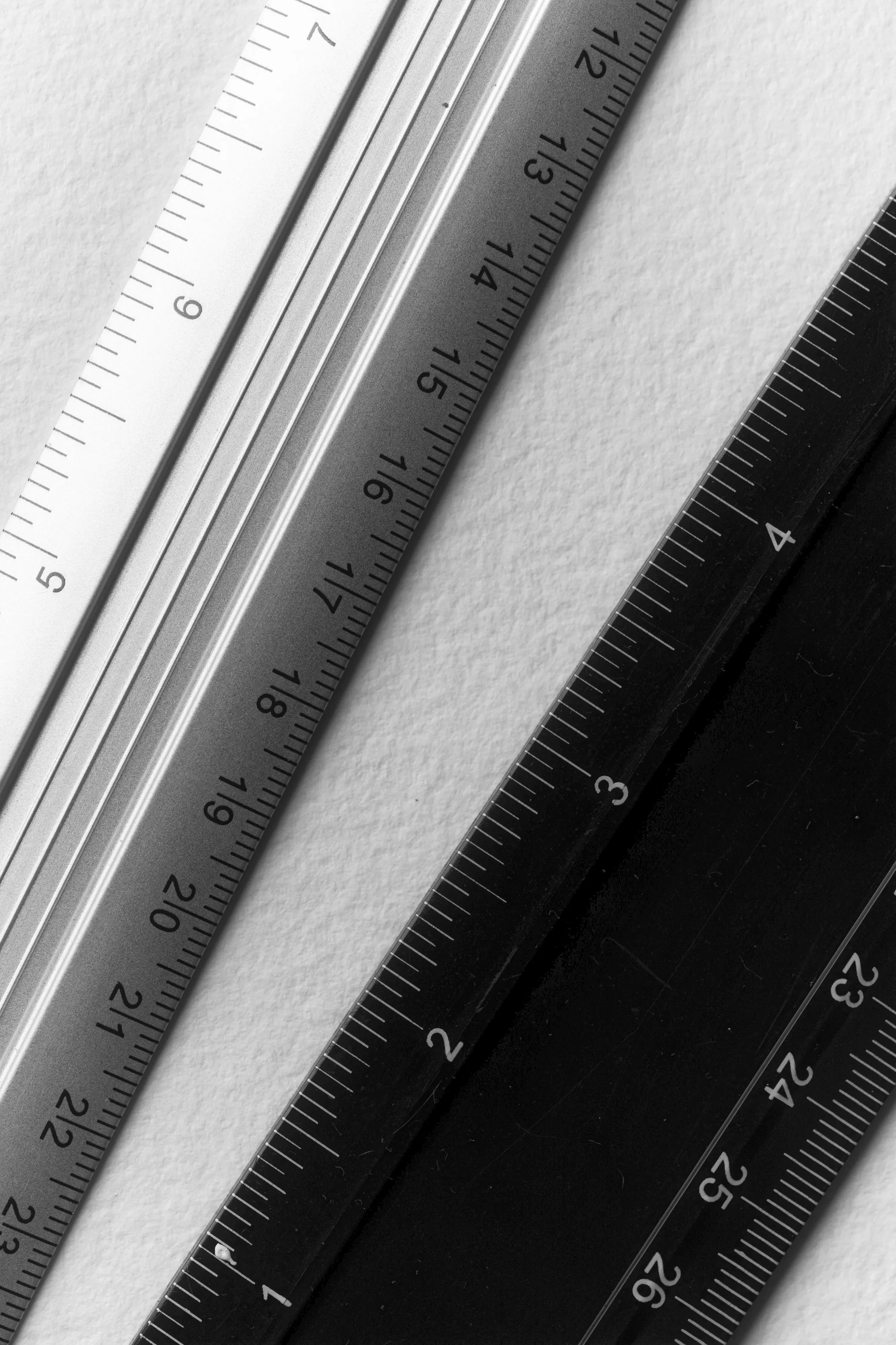 A black and white image of rulers.