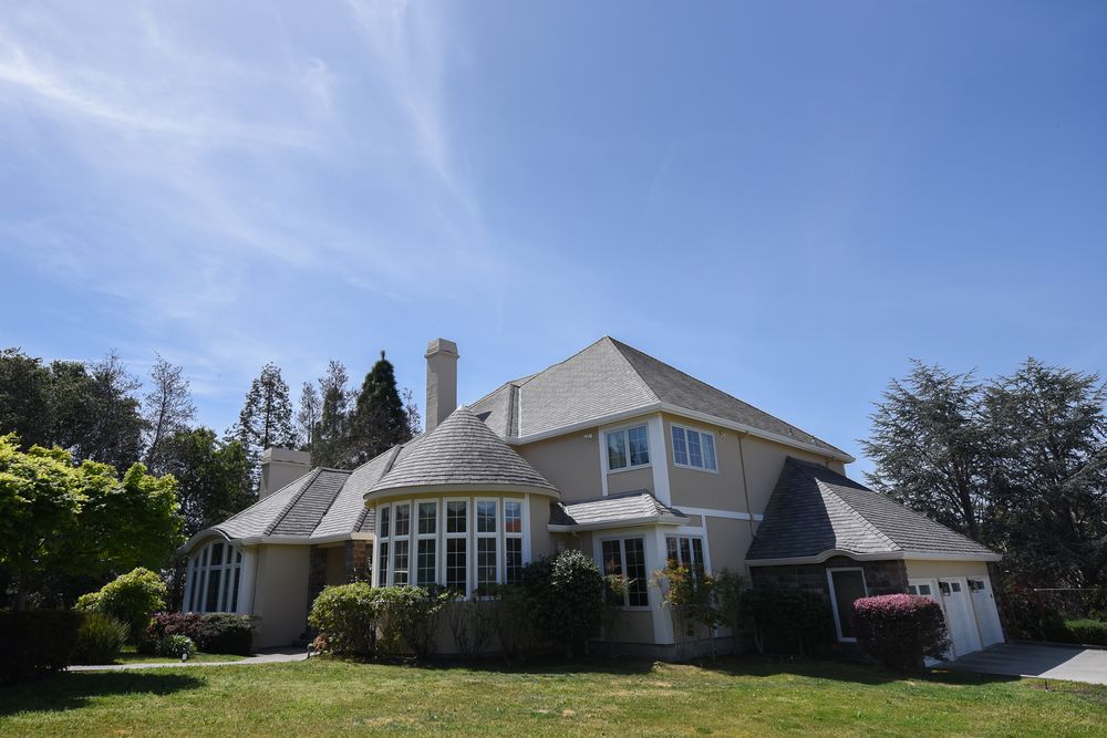 person writing on a piece of paper 