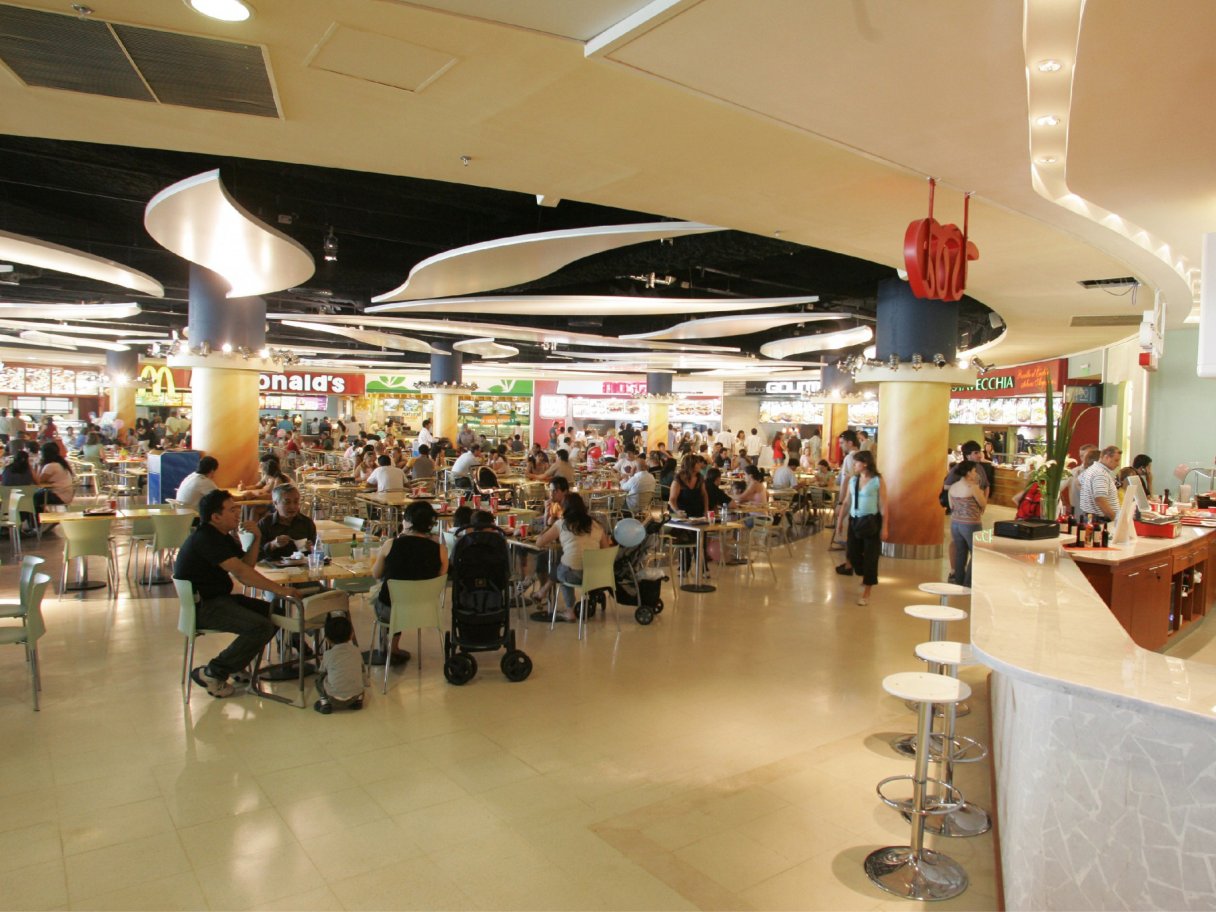 Rooftops of a coastal town with the sea in background