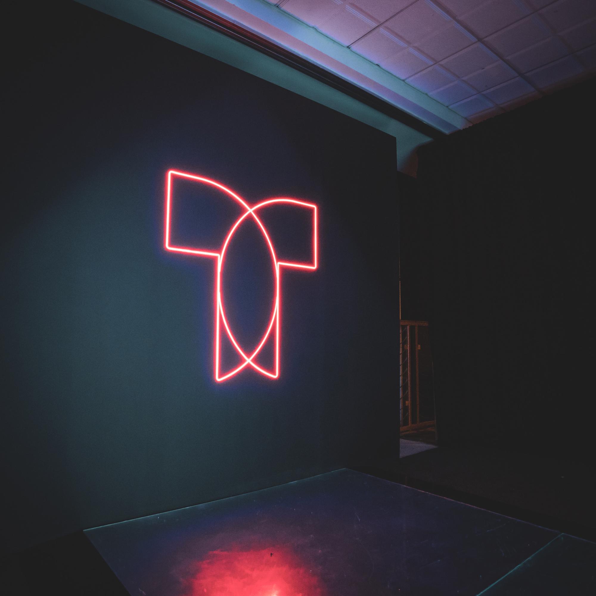 Illuminated Telemundo logo installation used as a branded visual element at an event.