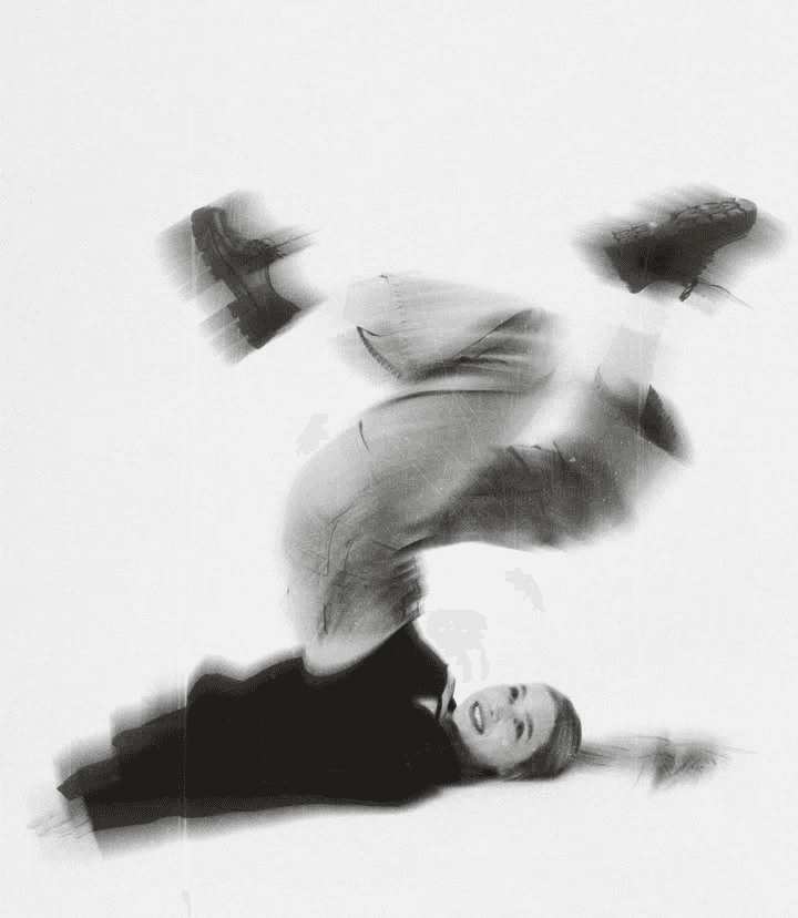 Elf woman in white dress raising hands by the river