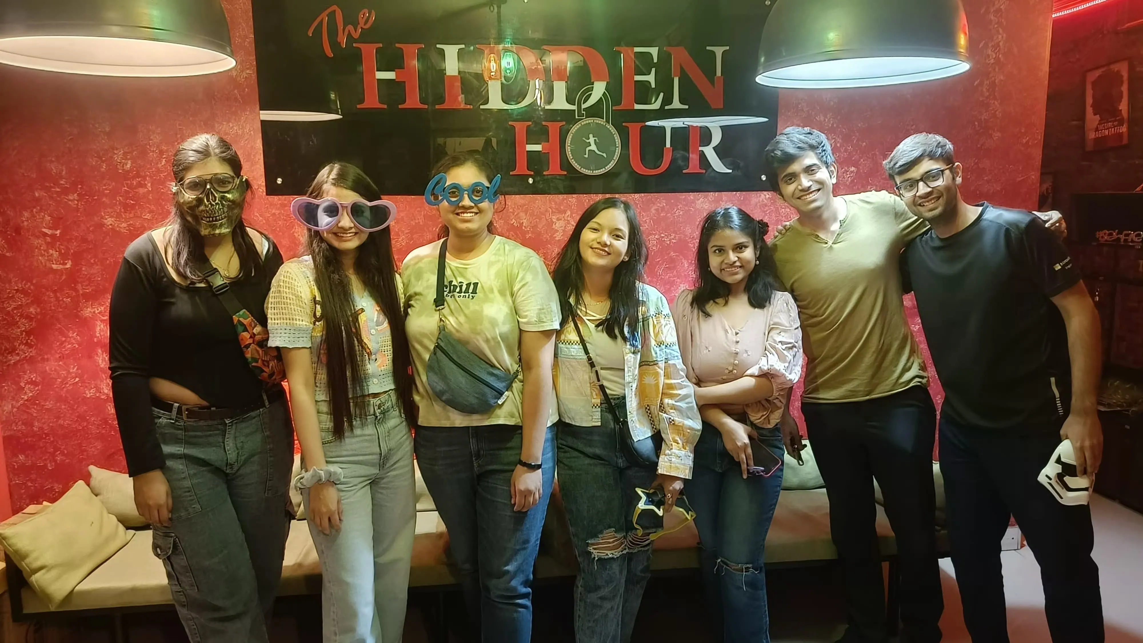 Family celebrating their win after a fun escape room game in Noida