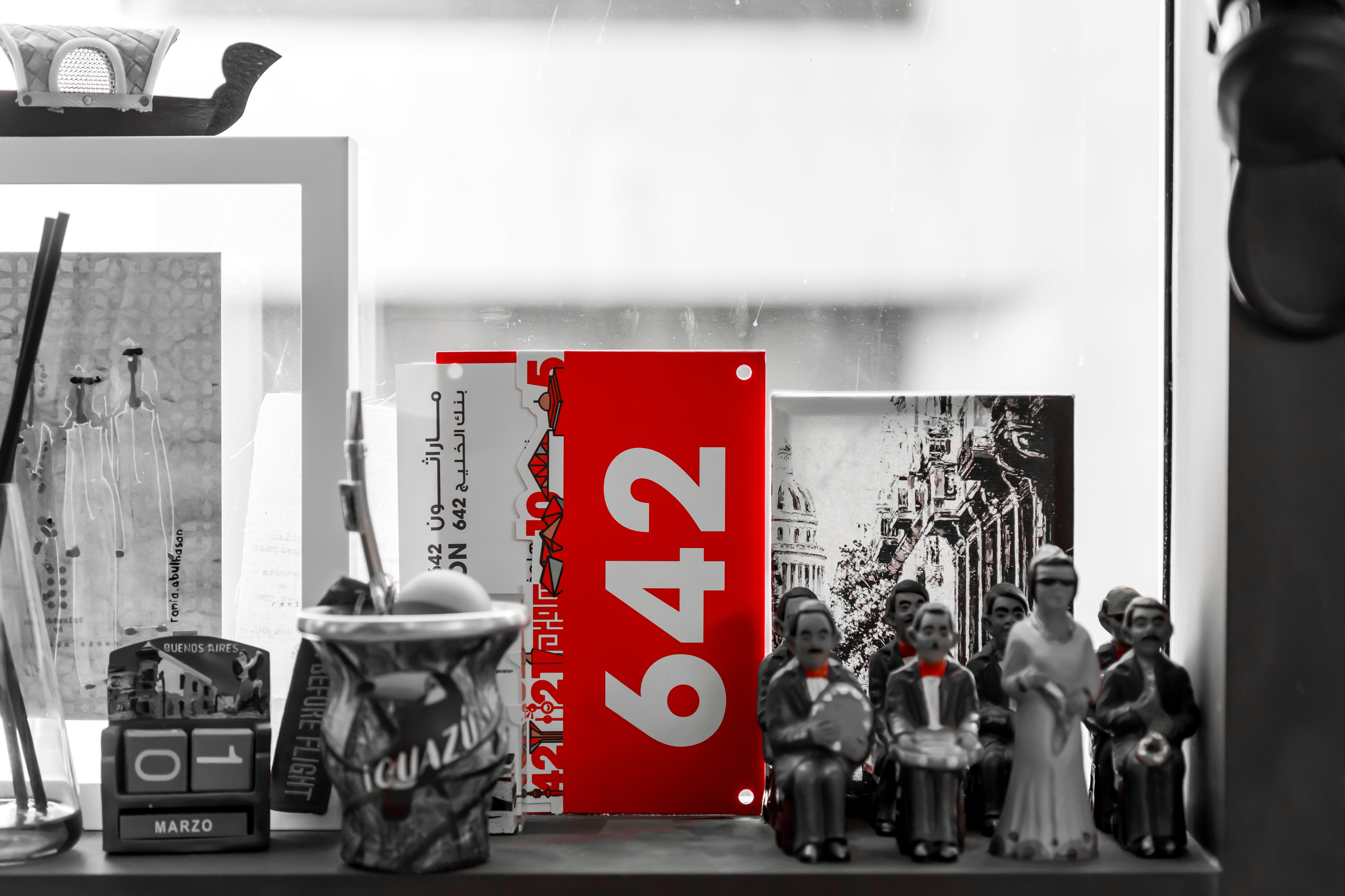 Young black woman witting at the table working on a laptop