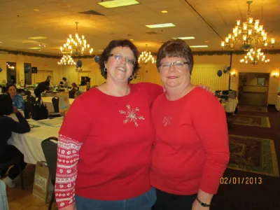 Shelley (left) and a friend in matching red tops at a crop