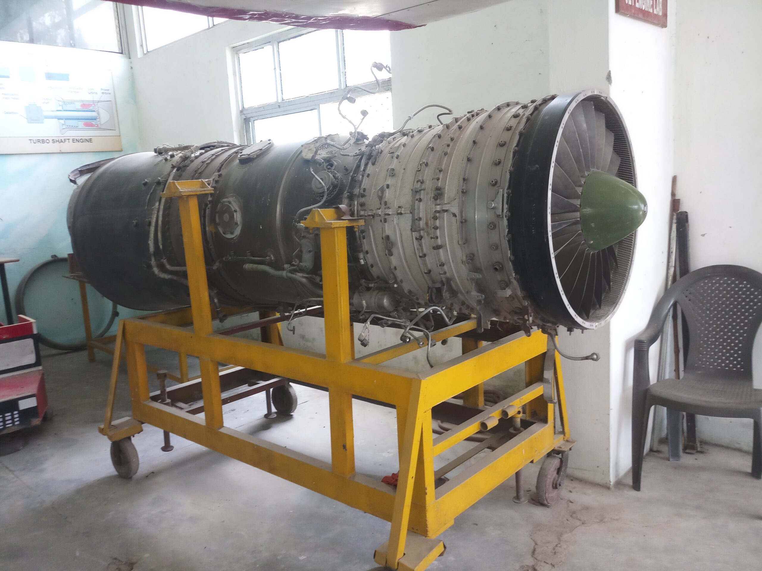Full moon rising behind a house at night