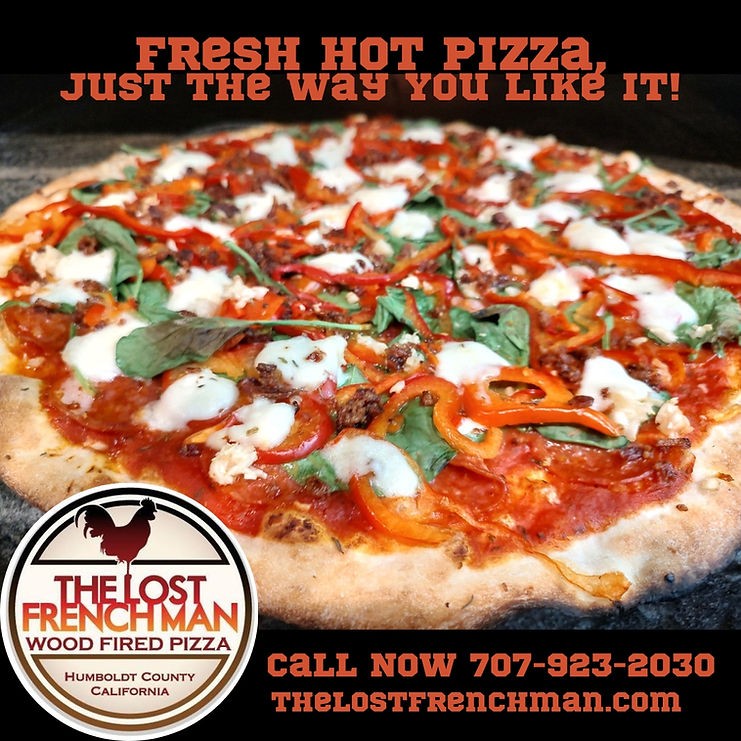 Wood-fired pizza in a promotional photo from The Lost Frenchman.