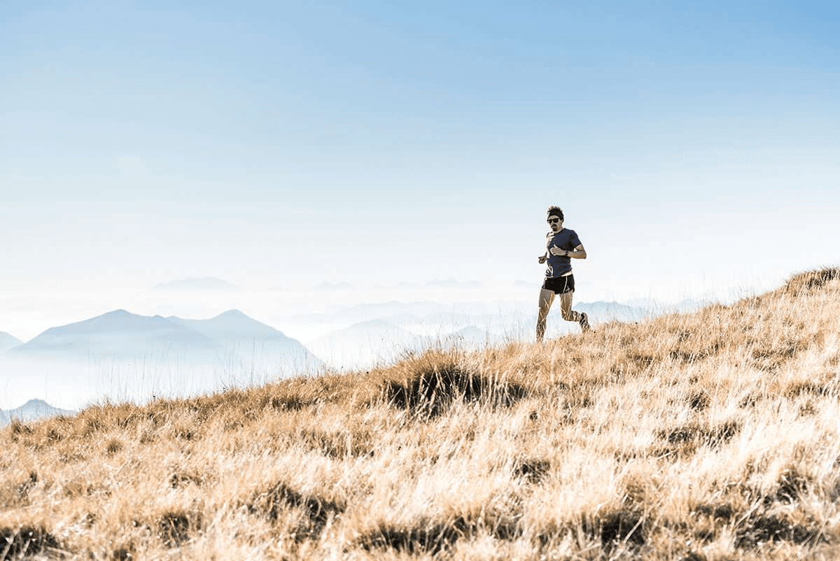 Deciding Between Bodybuilding and HIIT to Improve Body Composition man running on fields