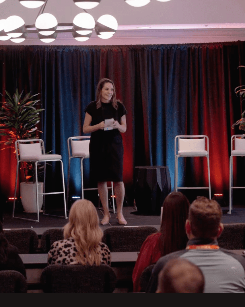 A member of the SmithRx team speaking on a stage at the Broker Account Summit