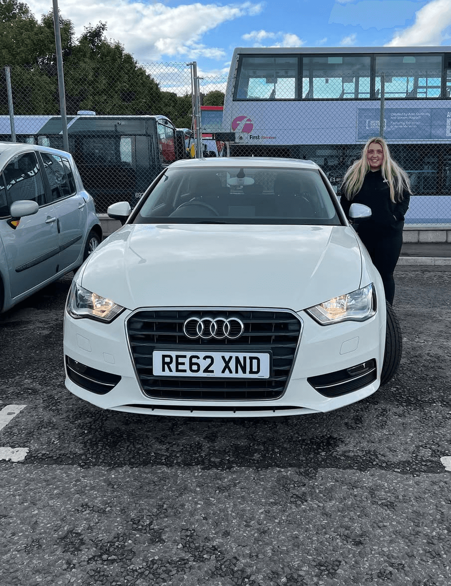 Luxury cars parked inside store.