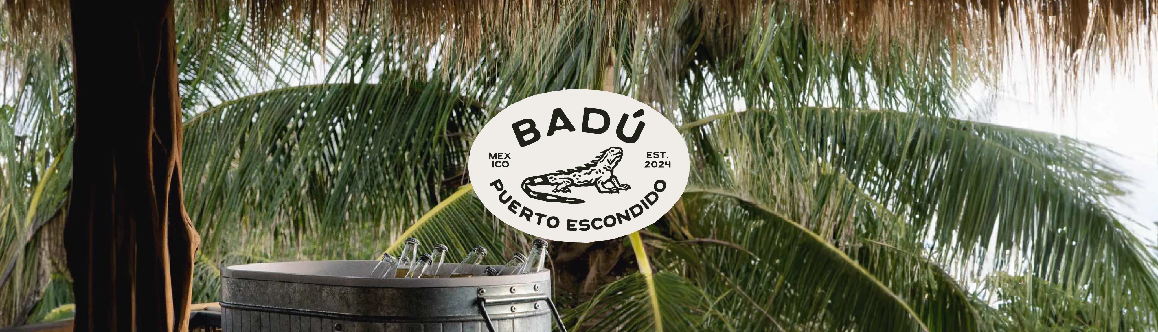Badu Logo on a tropical photo of the hotel