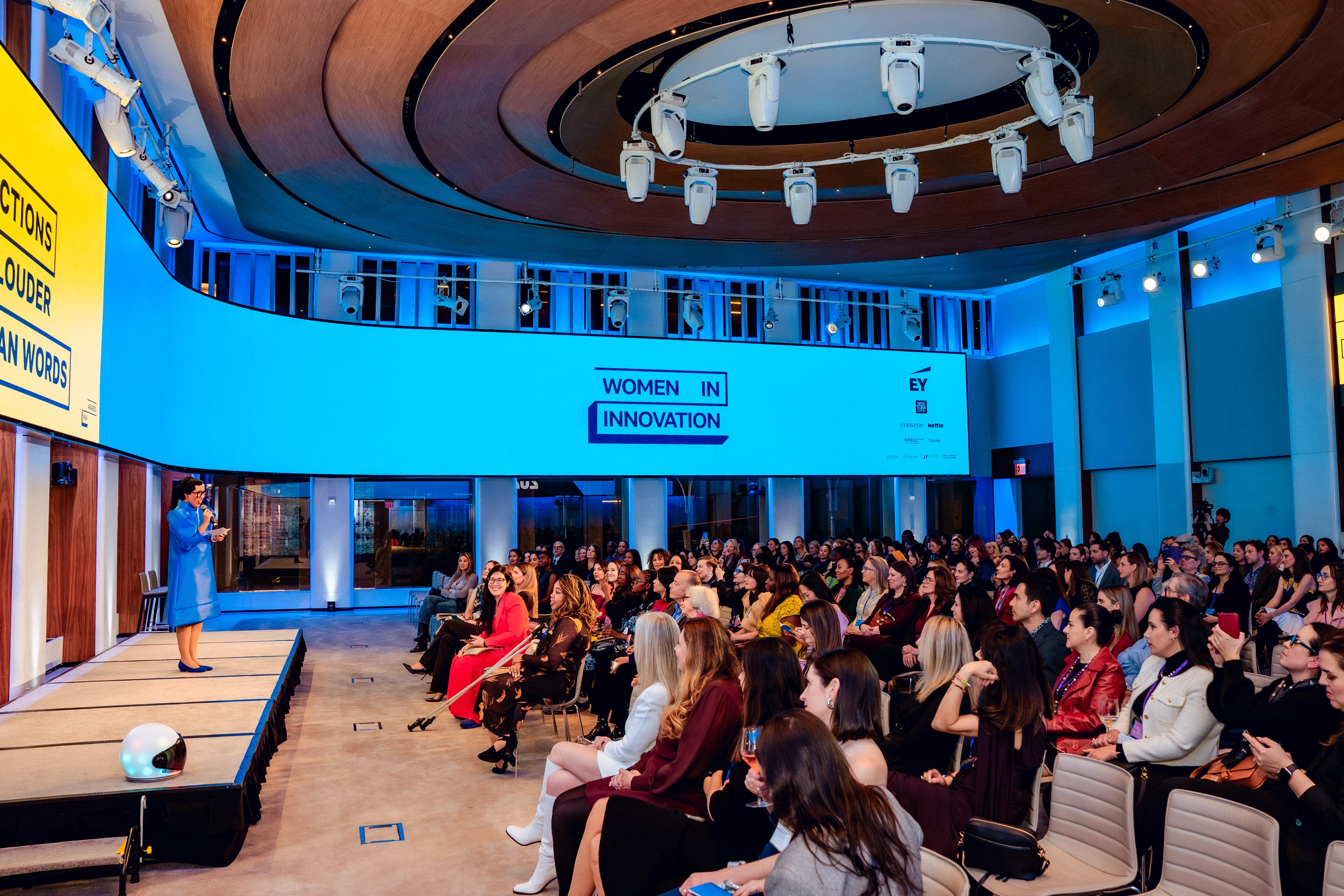 Speaker standing in front of slide with "welcome innovators" displayed