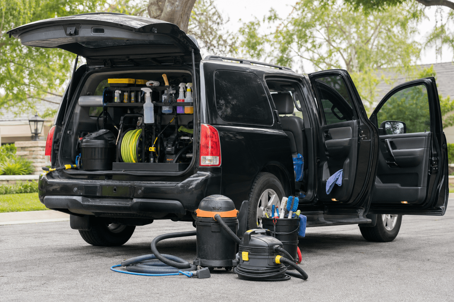 Mobile detailing vehicle loaded with organized professional equipment