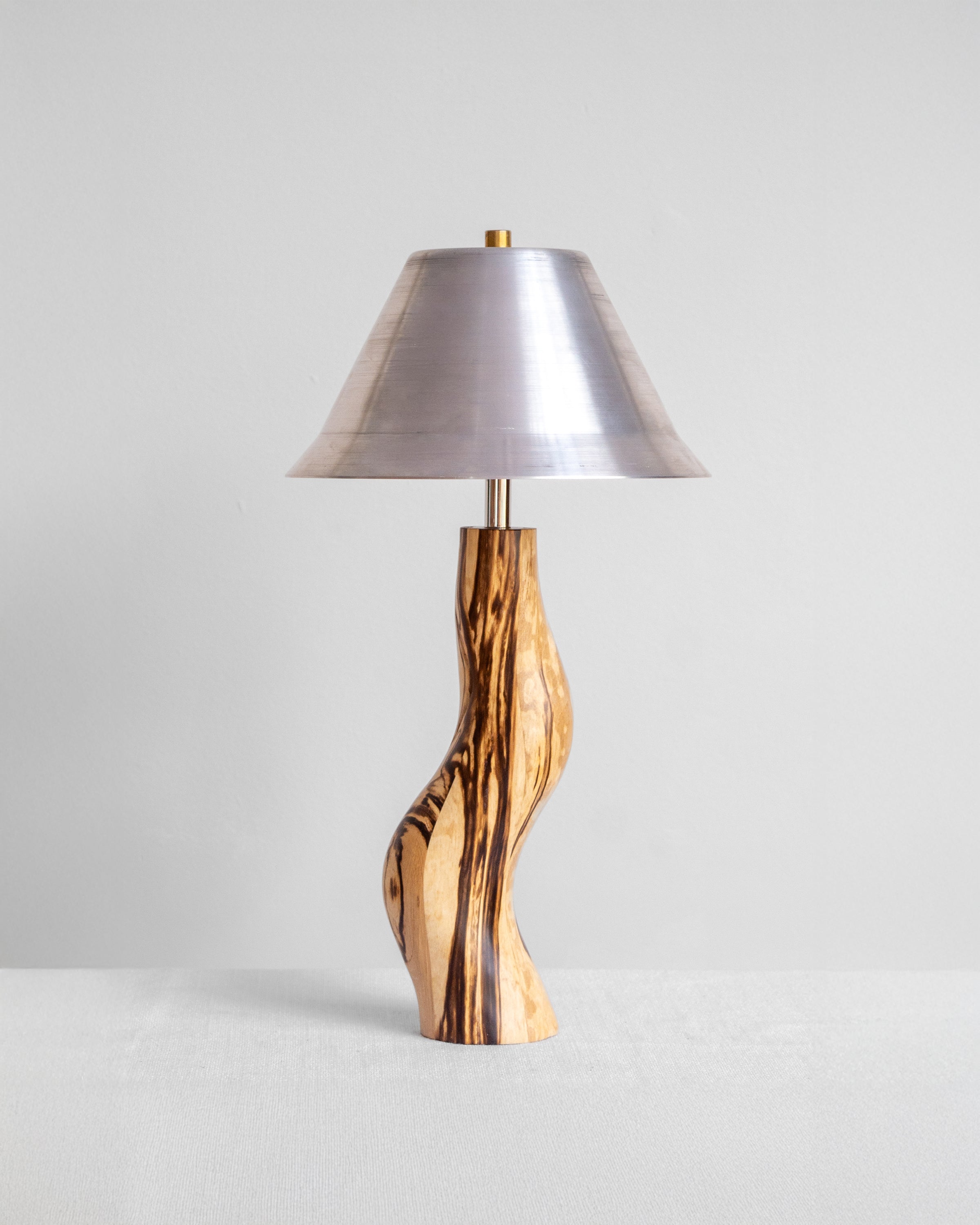 Dancing Desk Lamp with Spalted timber base and Aluminium shade on a light grey background with UK, EU and US/CA wiring available Wilkinson & Rivera