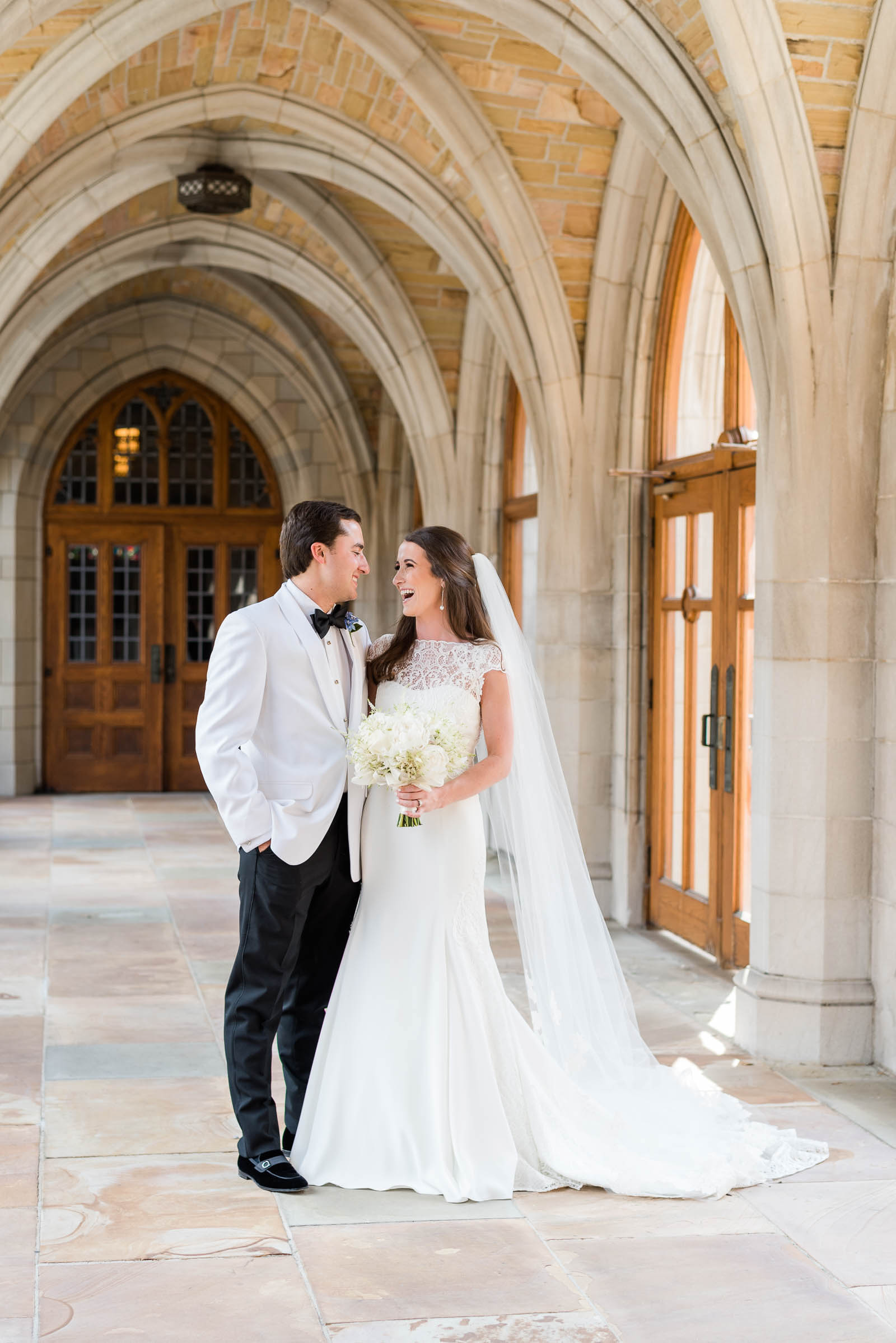 Wedding portrait of bride in groom in cathedral hallway downtown Nashville, Tennessee.