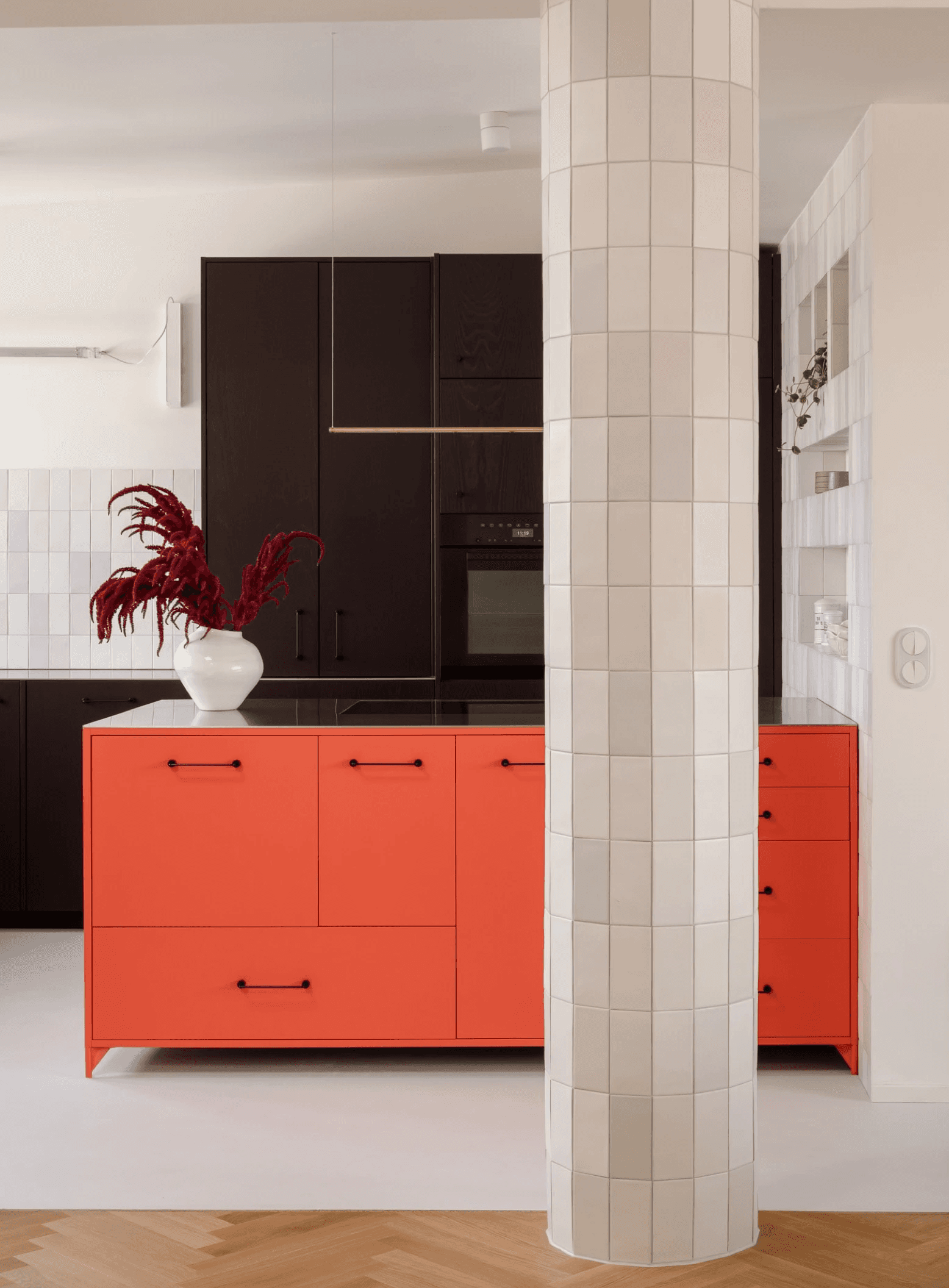 Red kitchen island in bespoke kitchen berlin penthouse