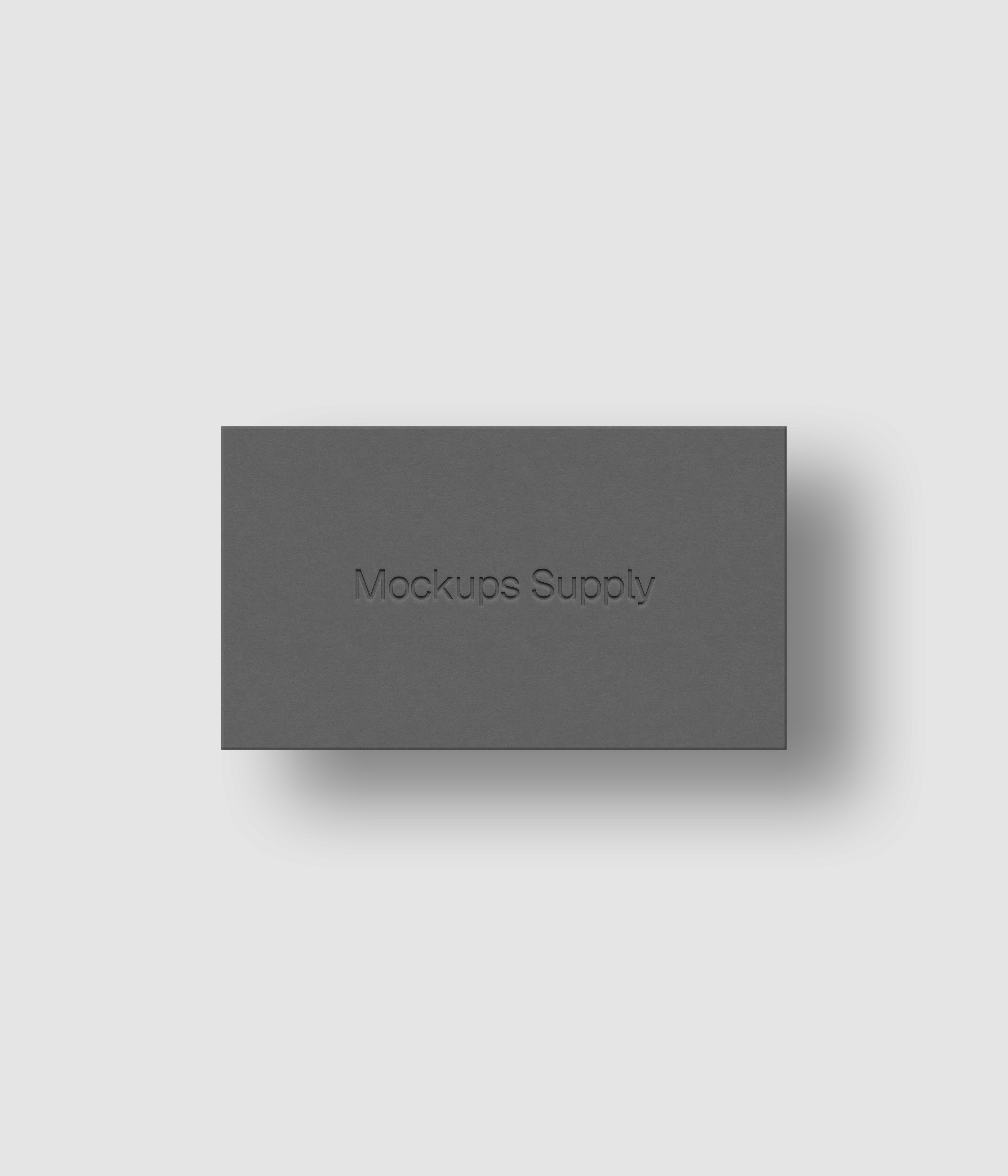 Business card mockup PSD US Canada landscape with debossed logo and soft shadow, gray card on white background, clean modern stationery mockup for brand identity