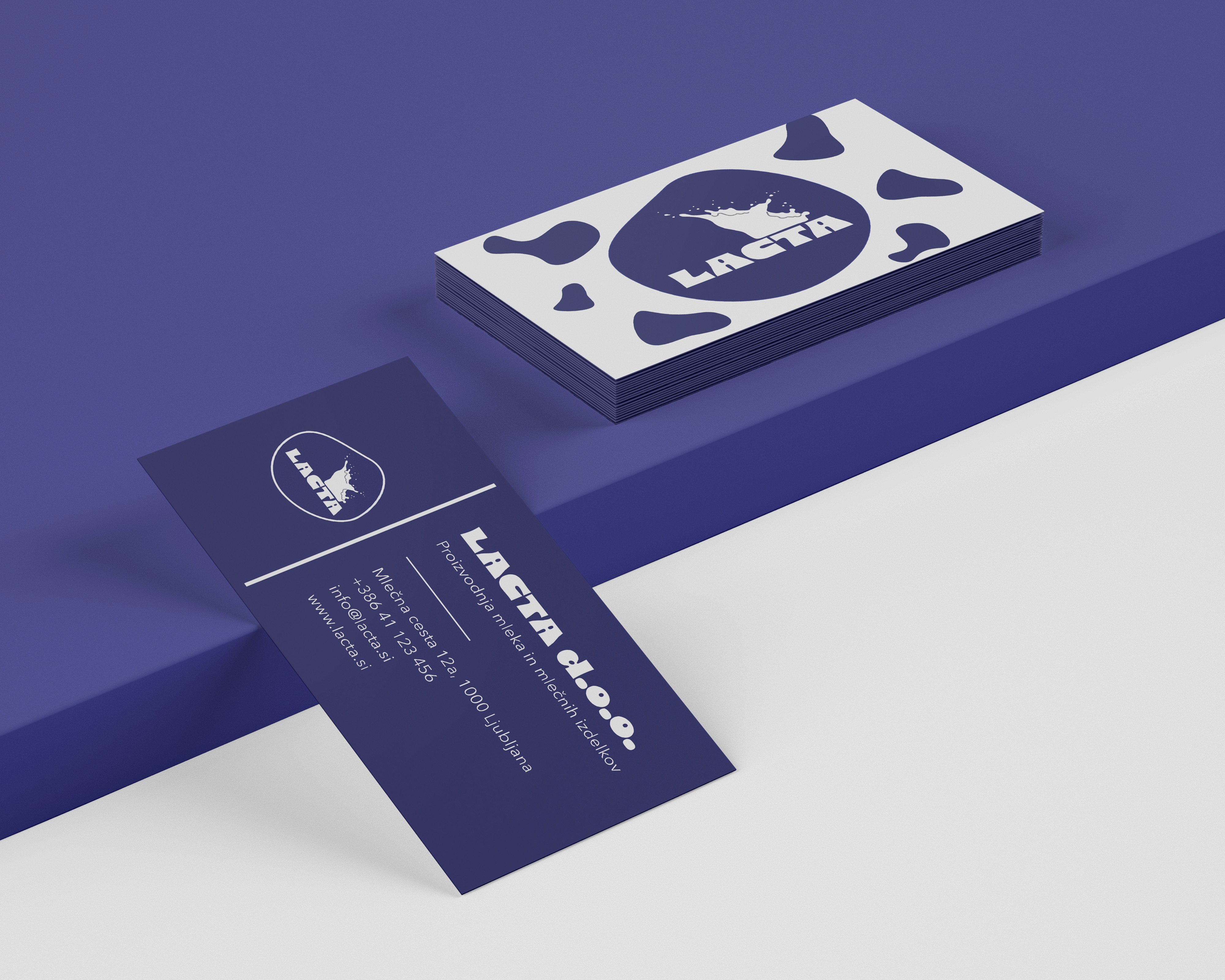 Lacta business cards with cow-spot pattern and brand details.