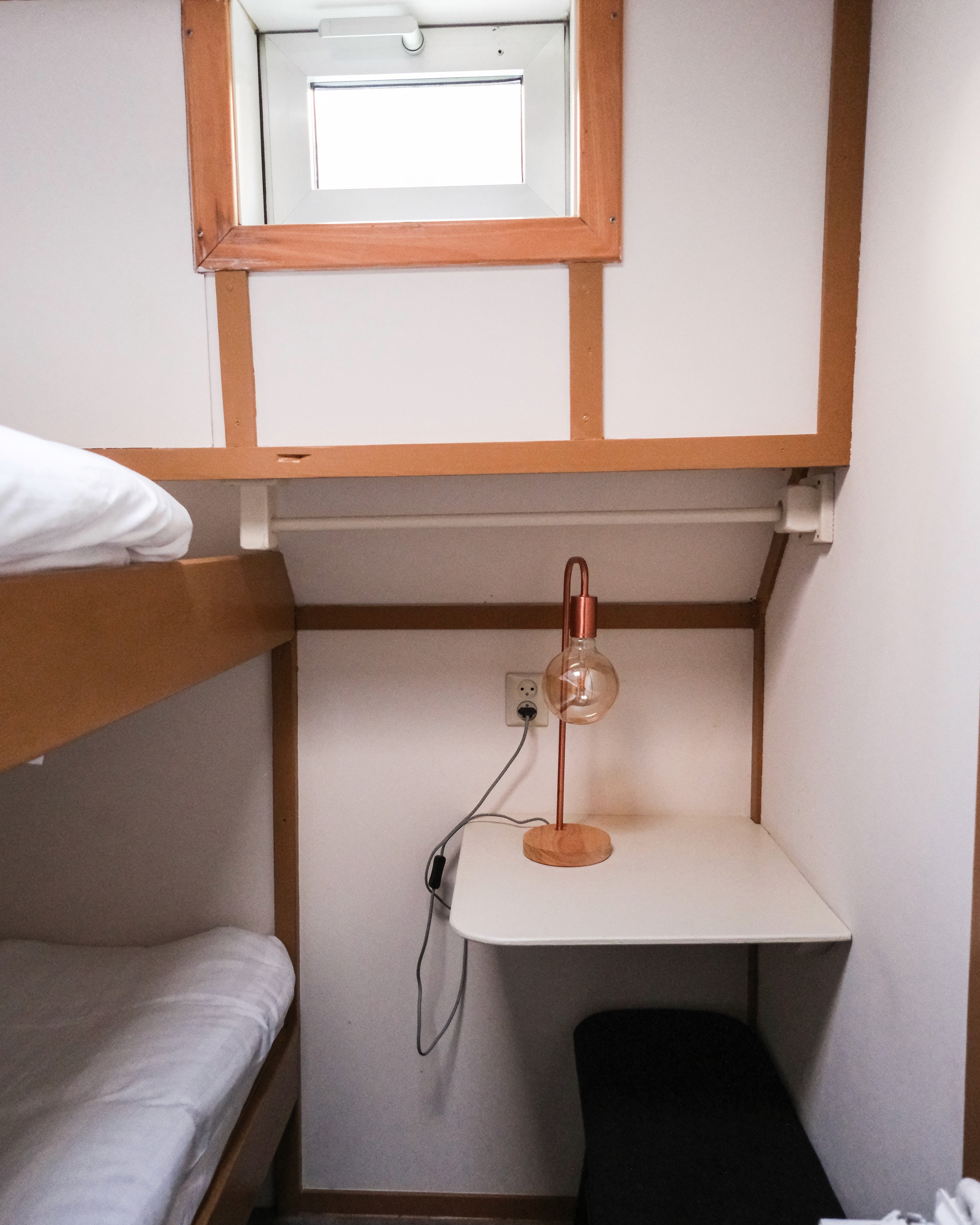 Classic bedroom with canopy bed and patterned pillows