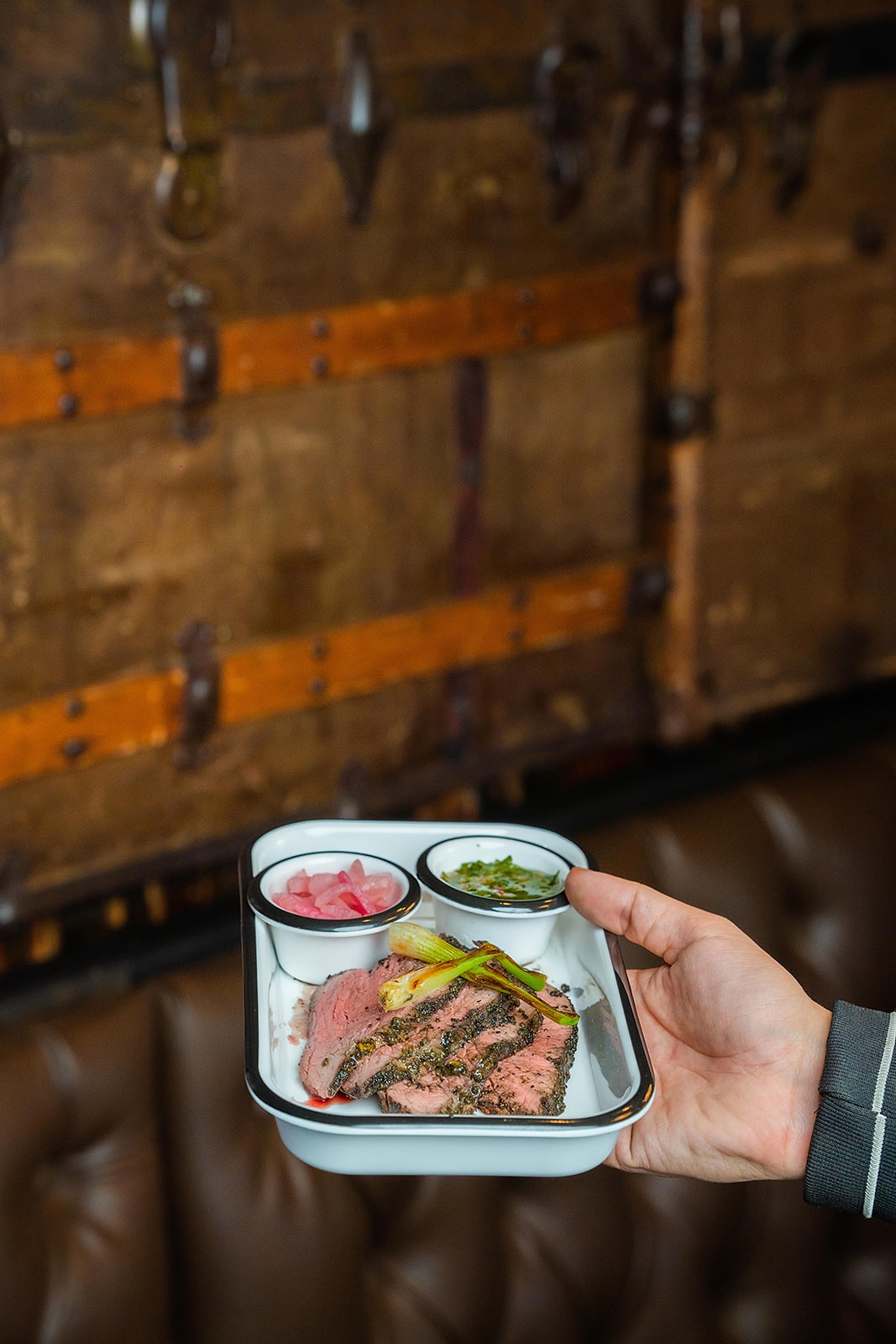 Oak and Ember plated barbecue dish with sauces