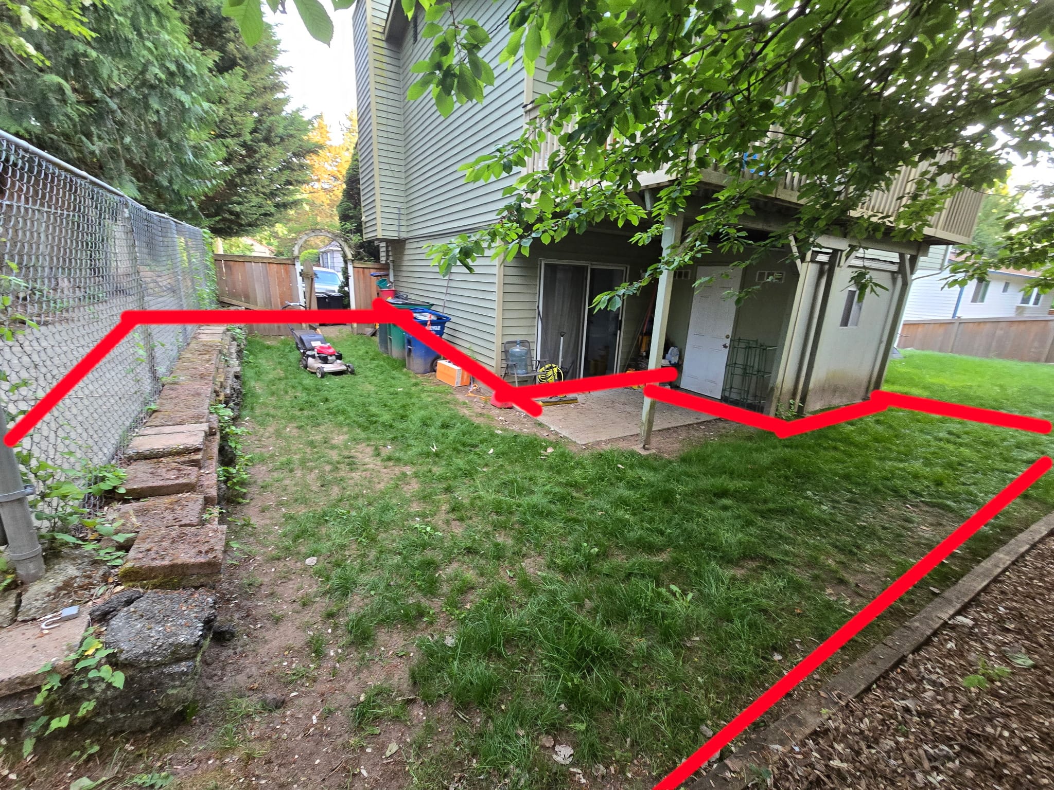 Modern two-story home with large glass windows, warmly lit interiors, and a balcony. Surrounded by trees and a manicured lawn at dusk. Cozy ambiance.