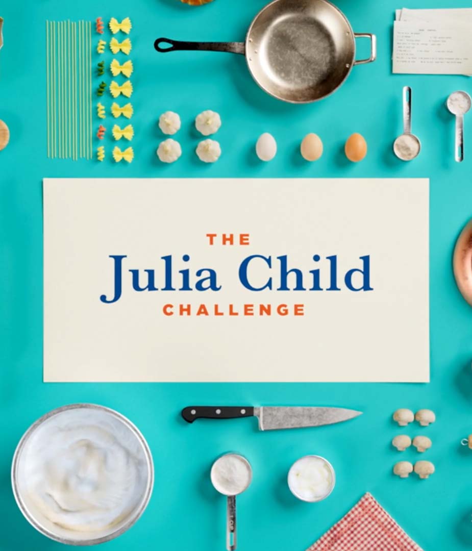Broadcast key art for The Julia Child Challenge featuring a flat lay of cooking utensils and ingredients framing the show title, designed to evoke nostalgic charm with a modern graphic system.