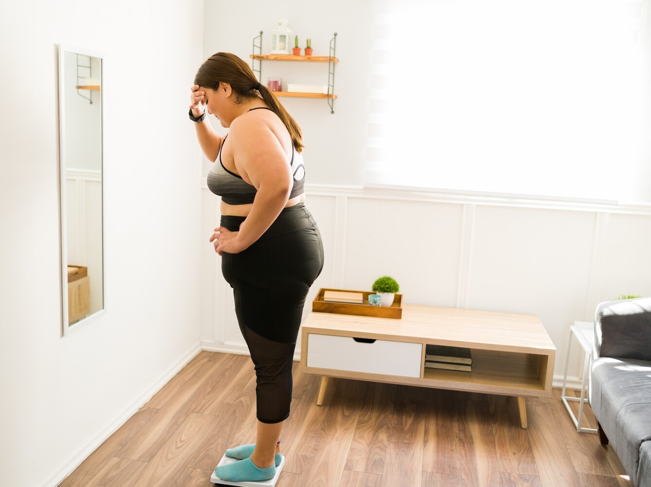 woman feeling disappointed by the results from her vibration plates and weight loss plan